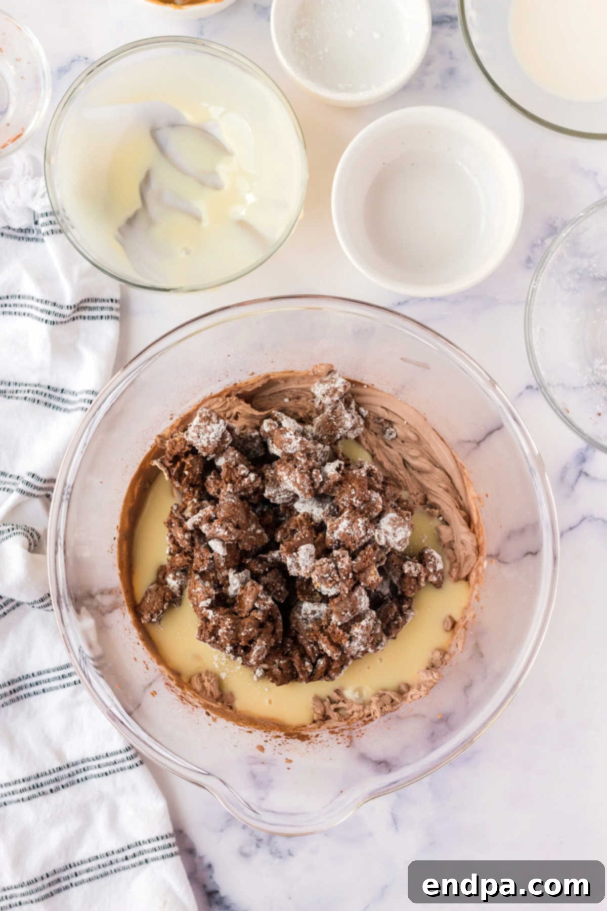 Muddy Munch Ice Cream 5 Mixing bowl with sweetened condensed milk and heavy cream, prior to whipping.