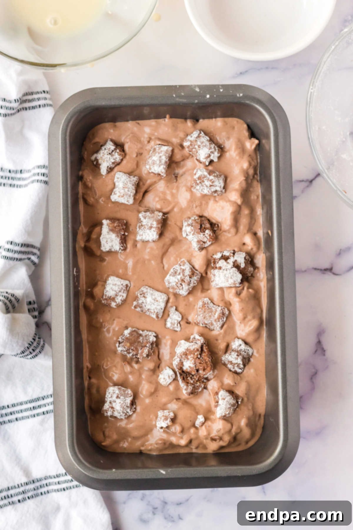 Muddy Munch Ice Cream 6 Ice cream mixture spread evenly into a loaf pan, ready for freezing.