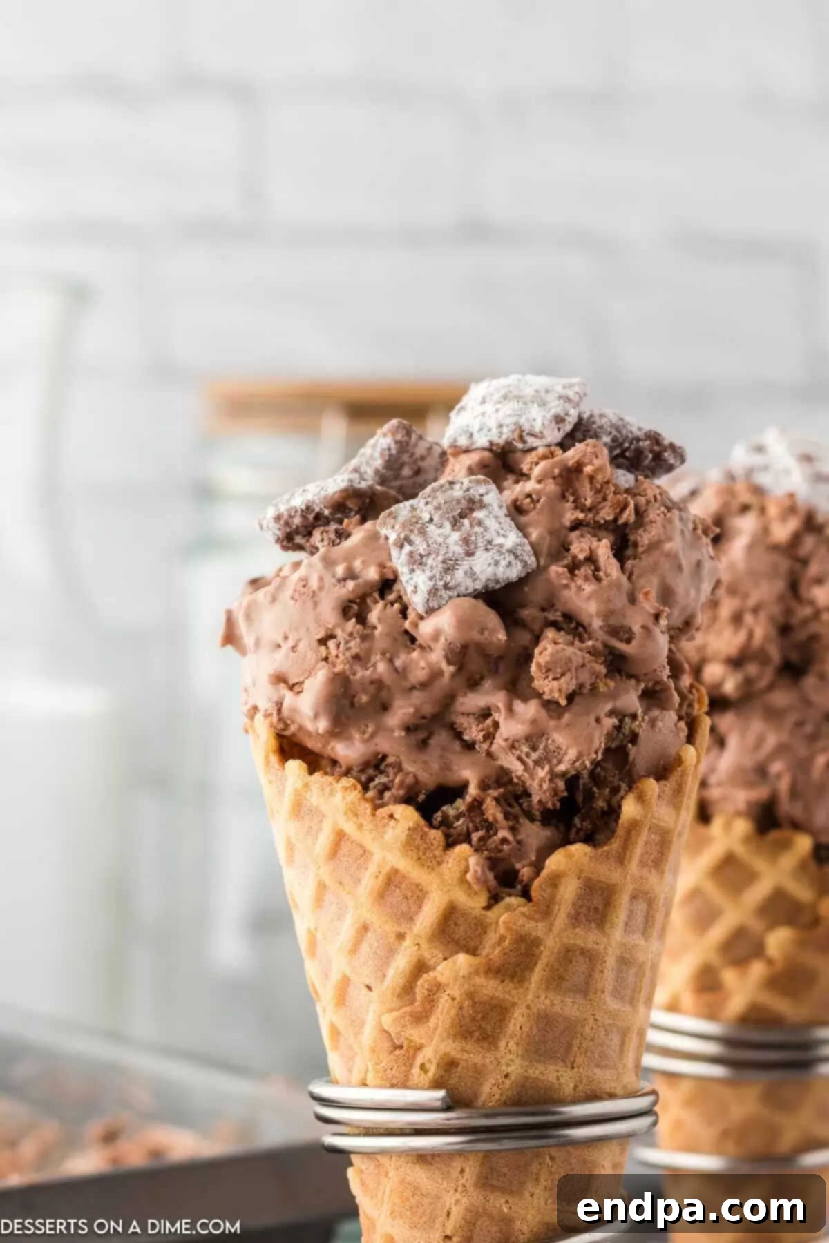 Muddy Munch Ice Cream 7 Scoops of Puppy Chow Ice Cream served in classic ice cream cones.