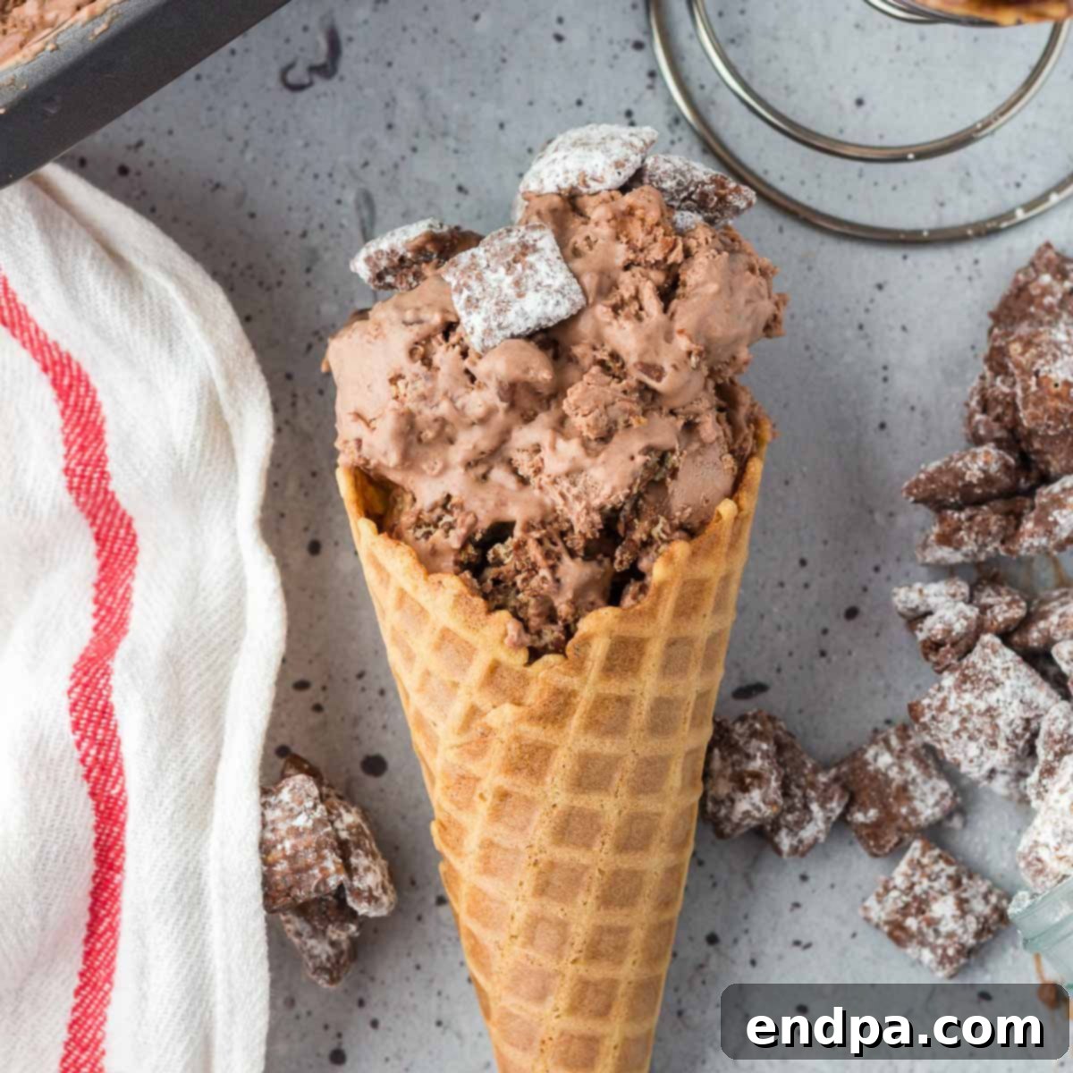 Muddy Munch Ice Cream 8 Scoops of Puppy Chow Ice Cream served in classic ice cream cones.