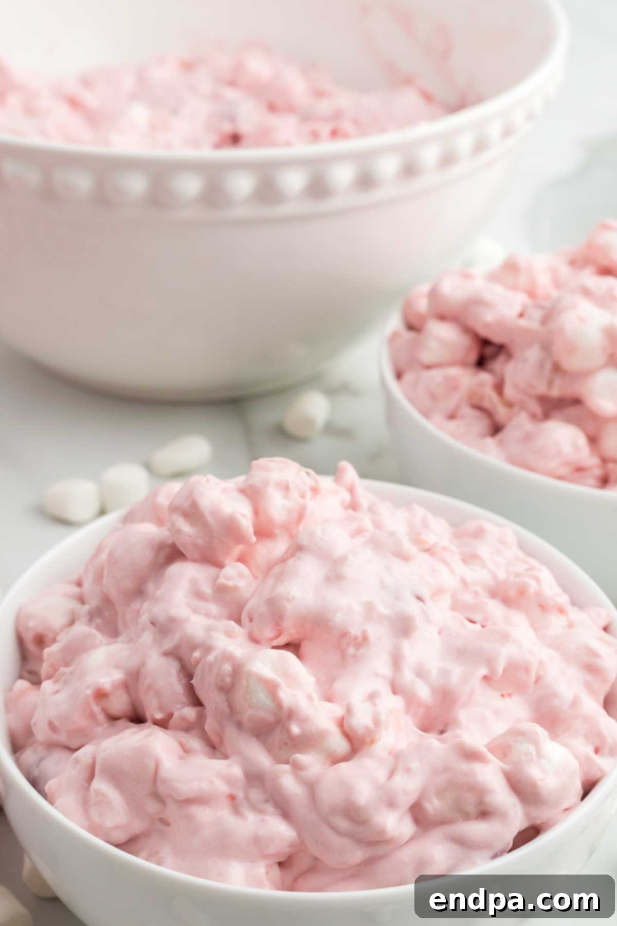 A beautifully presented bowl of Cherry Fluff Recipe, ready to be served. 