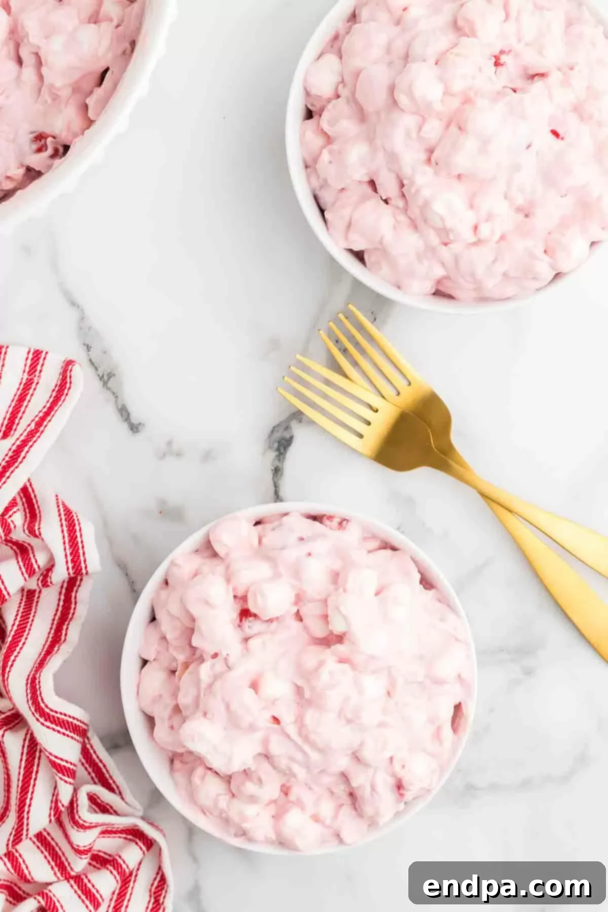 Another appealing shot of the Cherry Fluff recipe, showing its delightful pink color and fluffy texture in a serving bowl.