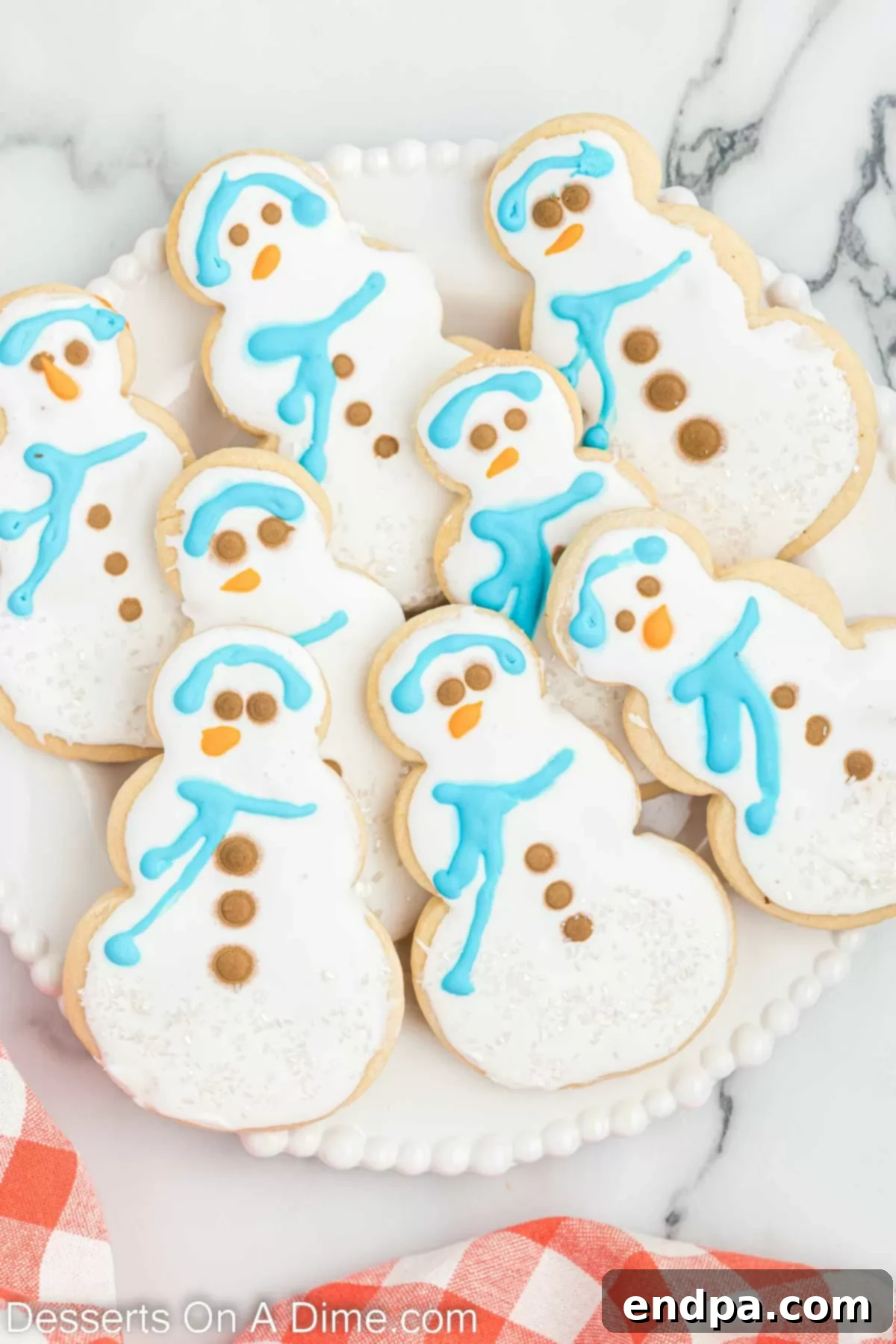 A beautifully arranged selection of finished Starbucks snowman cookies, showcasing their intricate decorations.