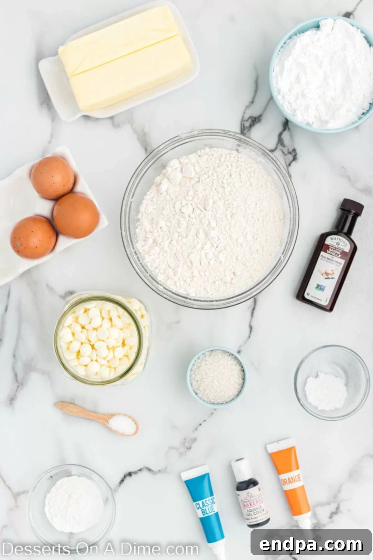 Fresh ingredients laid out for baking Starbucks snowman cookies, including flour, butter, white chocolate, and vanilla extract.