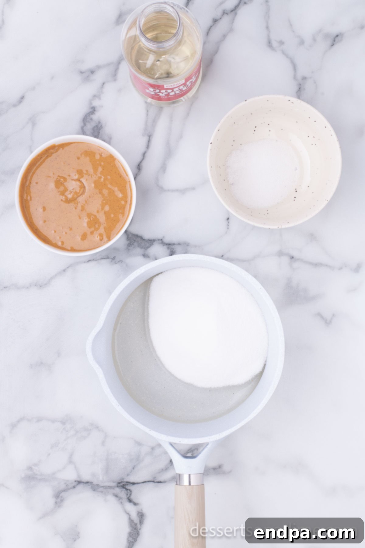 Cornflake Crunch Cookies 4 Granulated sugar and light corn syrup simmering in a saucepan over medium heat.