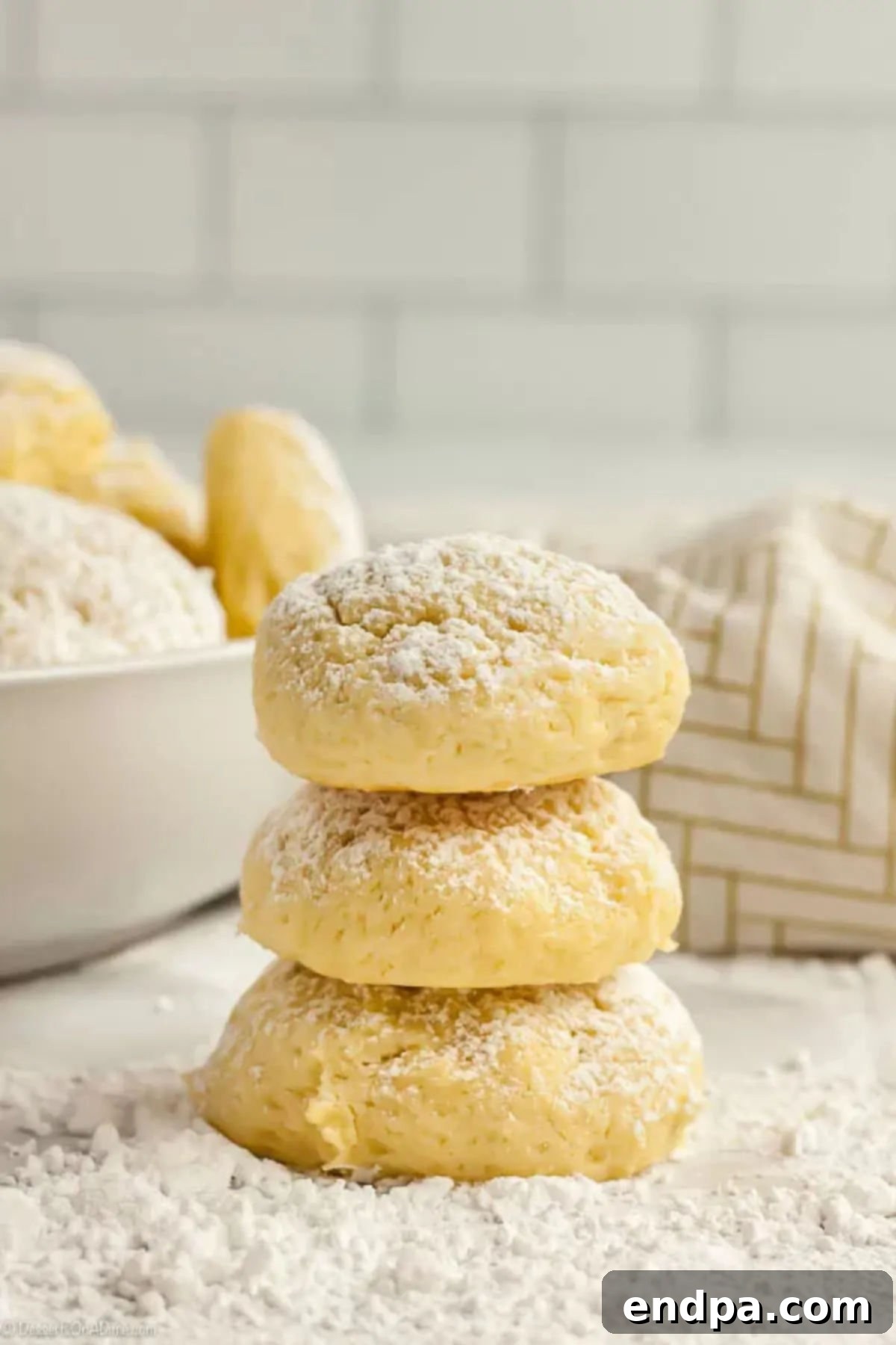 Velvety Cream Cheese Cookies 3 3 cream cheese cookies stacked on top of each other.