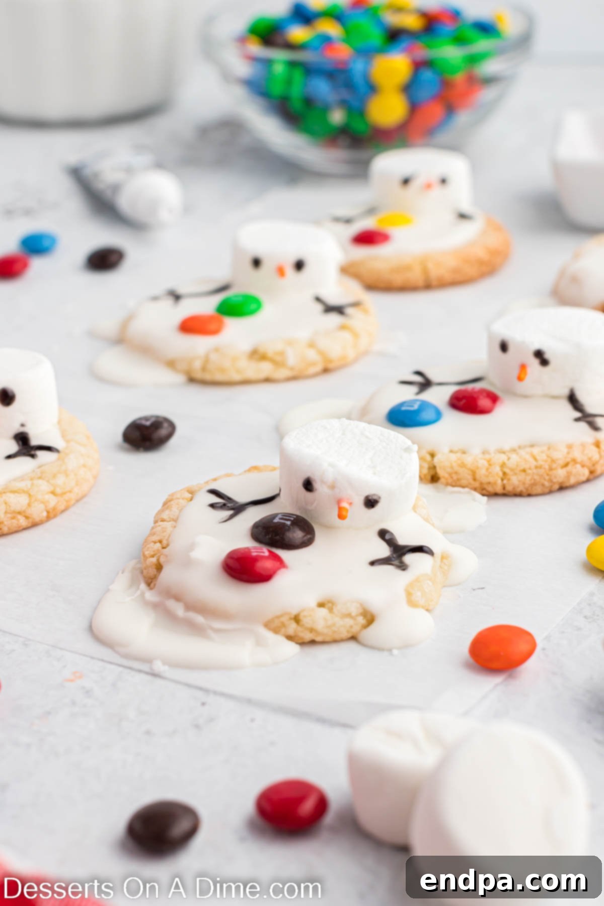 Whimsical Melted Snowman Treats 8 Melted snowman cookie up close. A charming close-up of a finished melted snowman cookie, highlighting its delightful details against a festive backdrop.