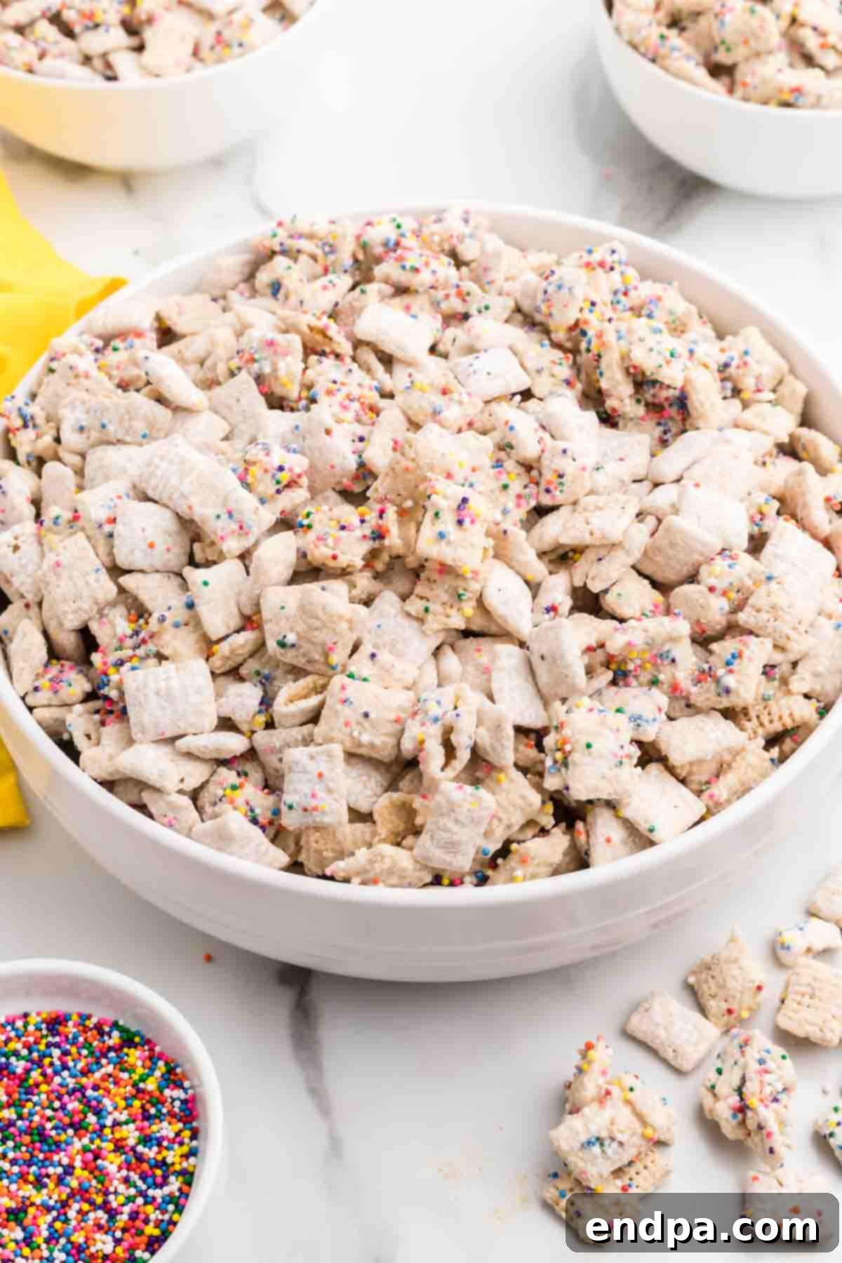 Birthday Cake Snack Mix 2 Cake batter puppy chow in a bowl.