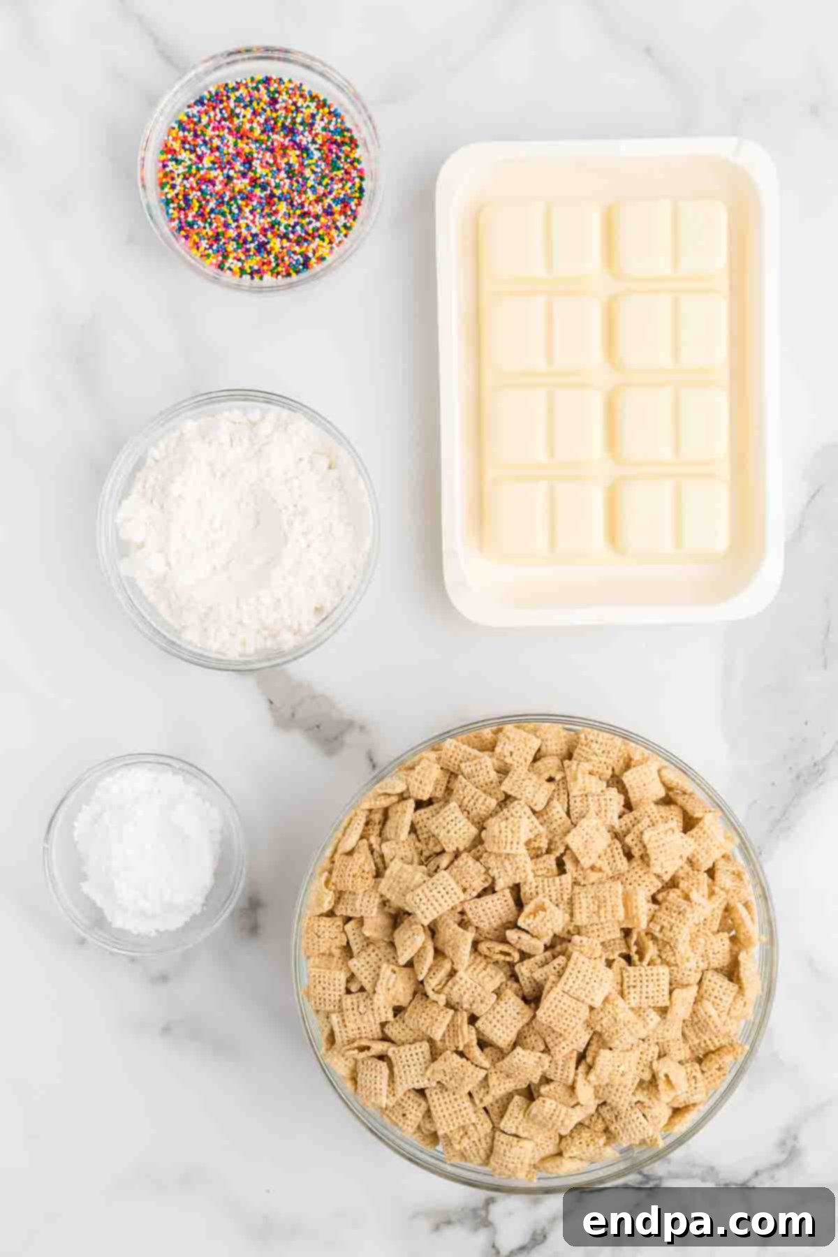 Birthday Cake Snack Mix 3 Ingredients for Cake batter puppy chow - chex cereal, vanilla candy coating, white cake mix, powdered sugar, rainbow sprinkles.