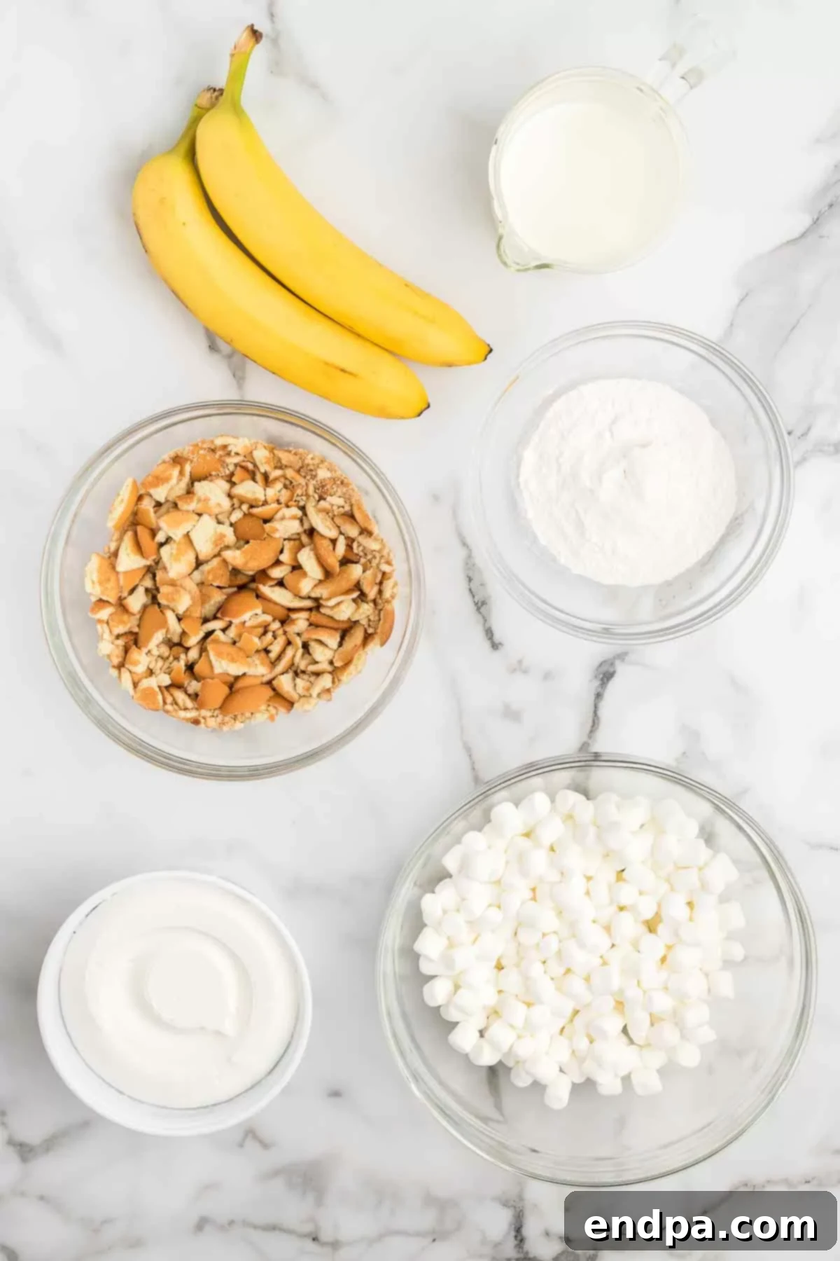 Ingredients for Banana pudding fluff - banana instant pudding, milk, cool whip, mini marshmallows, vanilla wafers, bananas. 