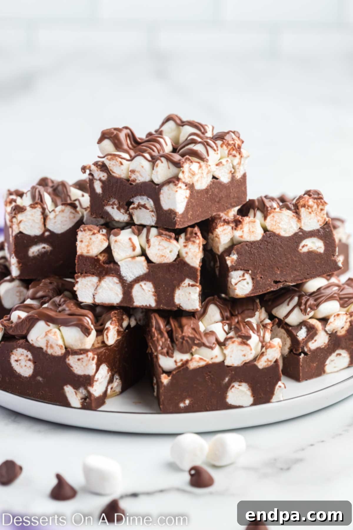 Hot chocolate fudge squares arranged neatly on a plate, ready to be enjoyed.