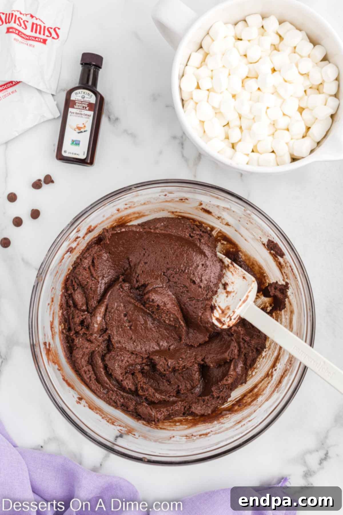 Combined ingredients for fudge after melting, showing a smooth, glossy batter.
