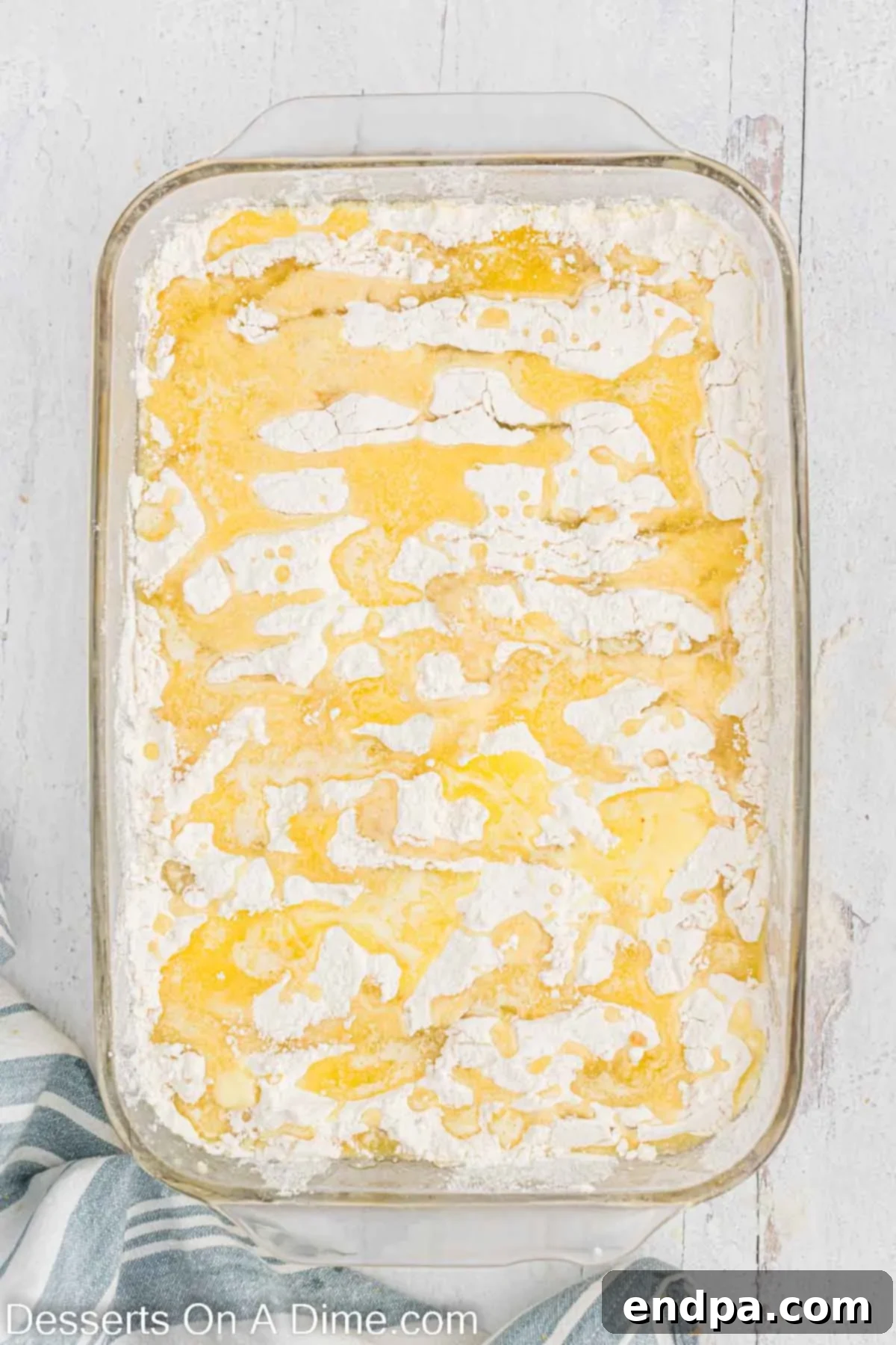 Melted butter drizzled over cake mix. 