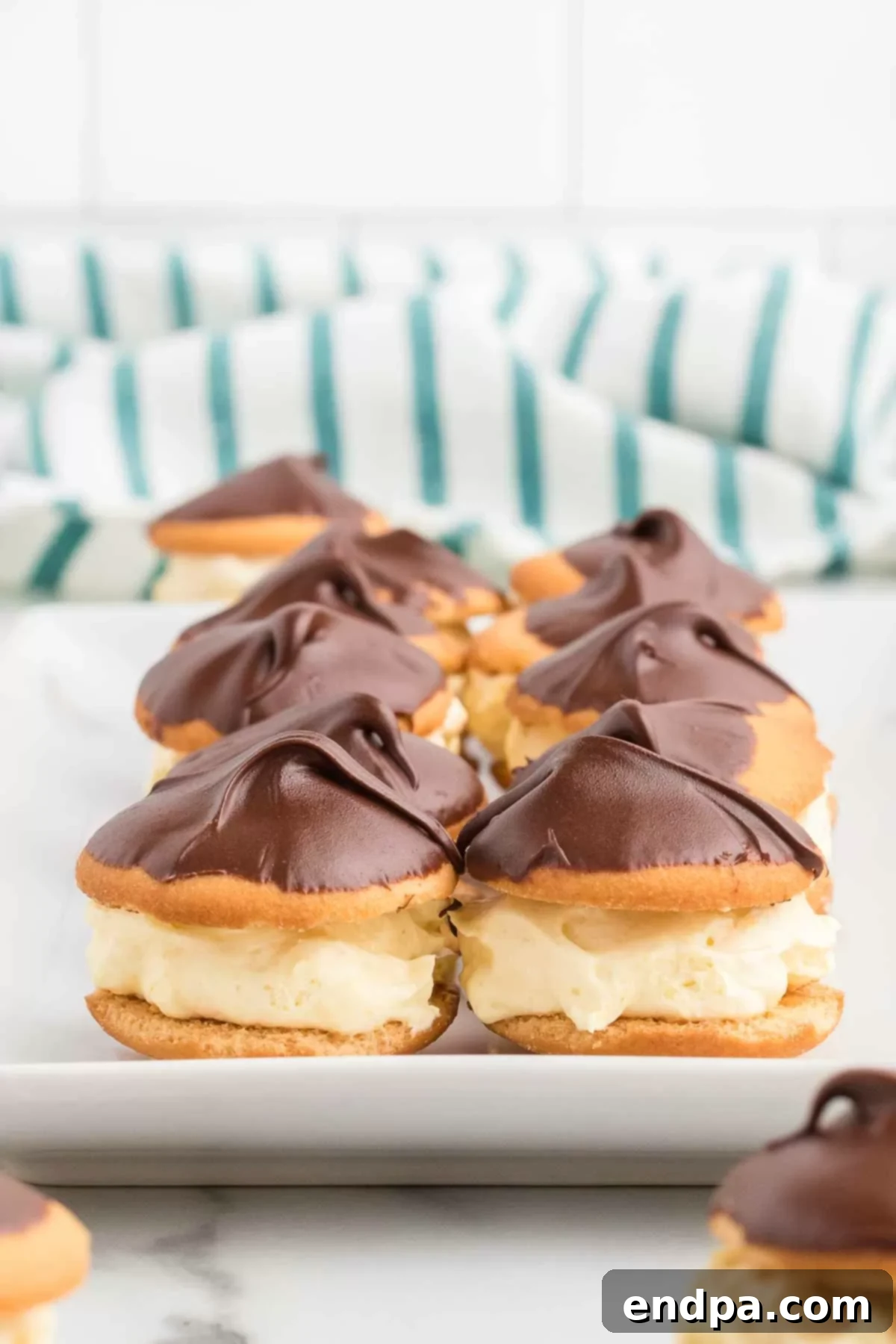 Eclair Cookie Fusion 10 A festive platter showcasing perfectly set Eclair Cookies, garnished and ready for serving at a celebratory event.