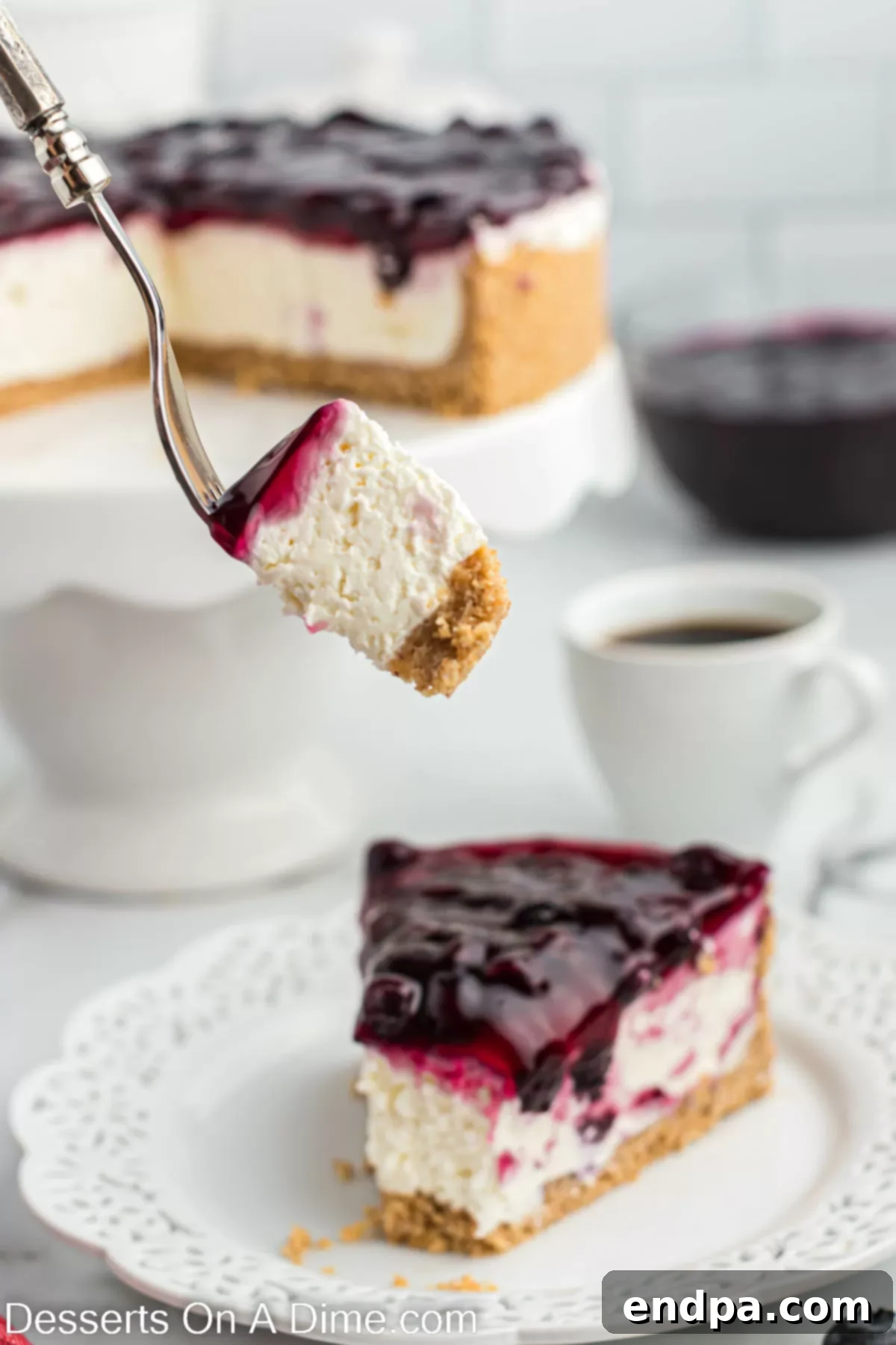 No bake blueberry cheesecake sliced on a plate. 