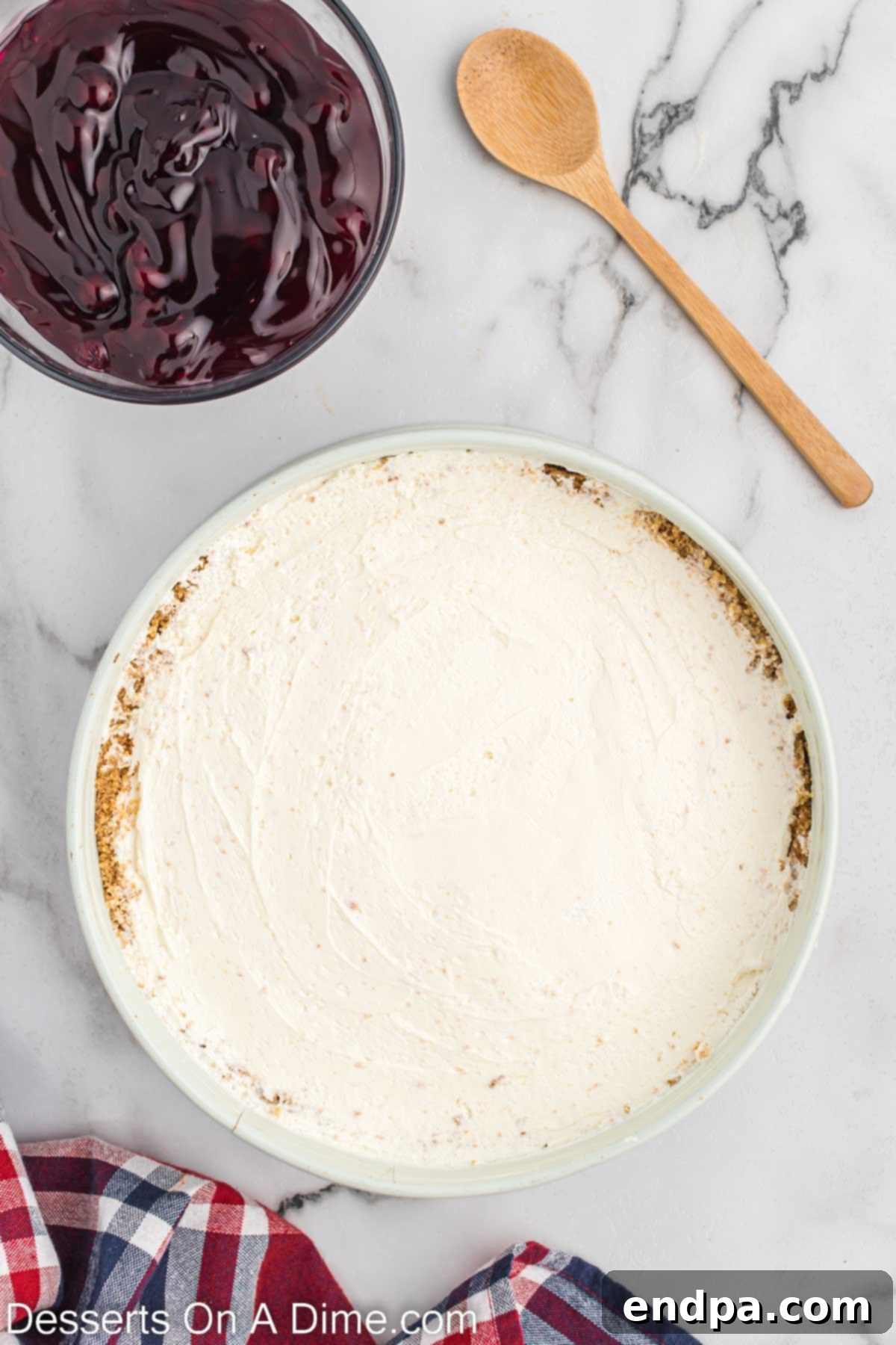 Cream cheese mixture spread into pie dish over the graham cracker crust. 