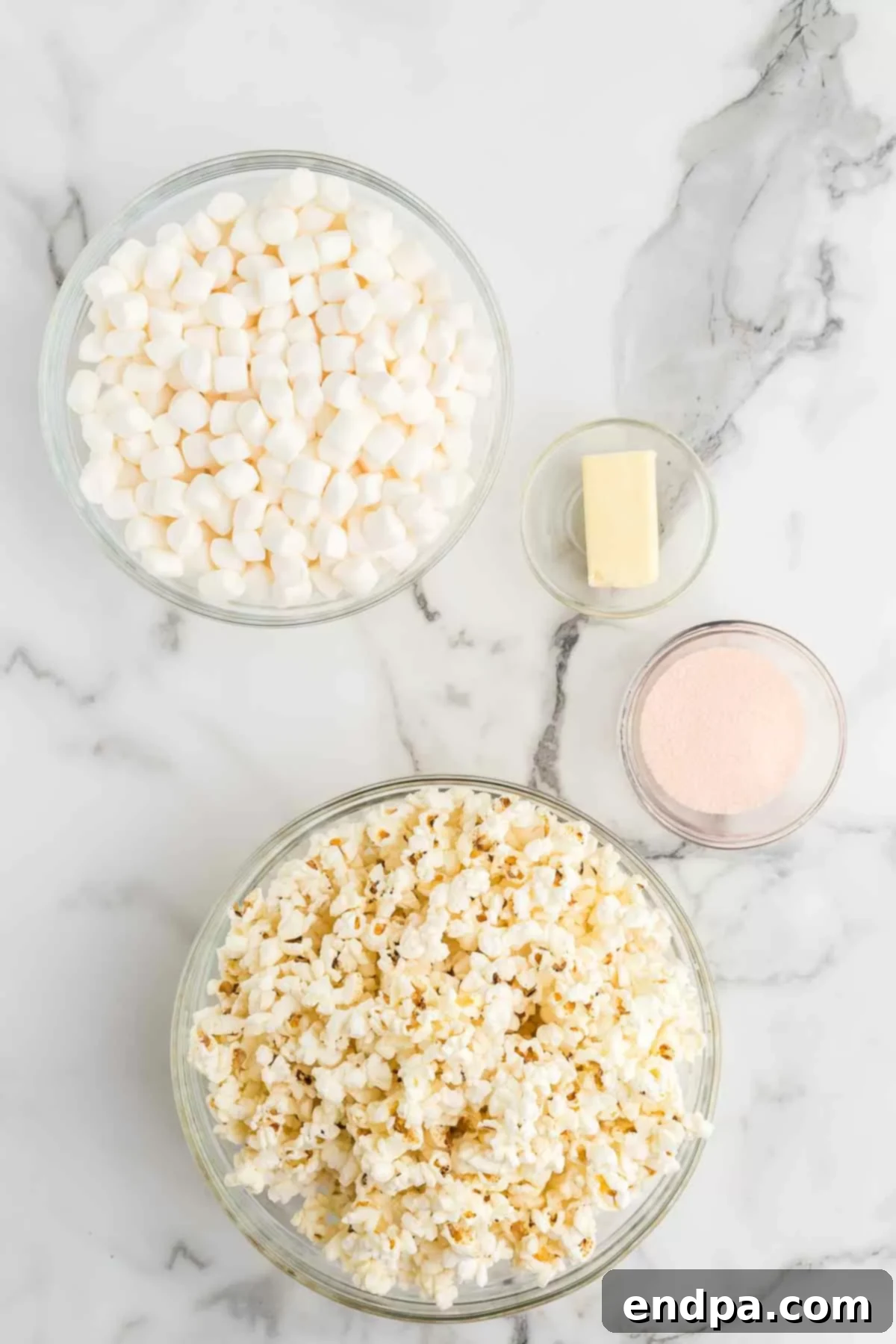 Ingredients in Jello popcorn balls laid out on a surface.