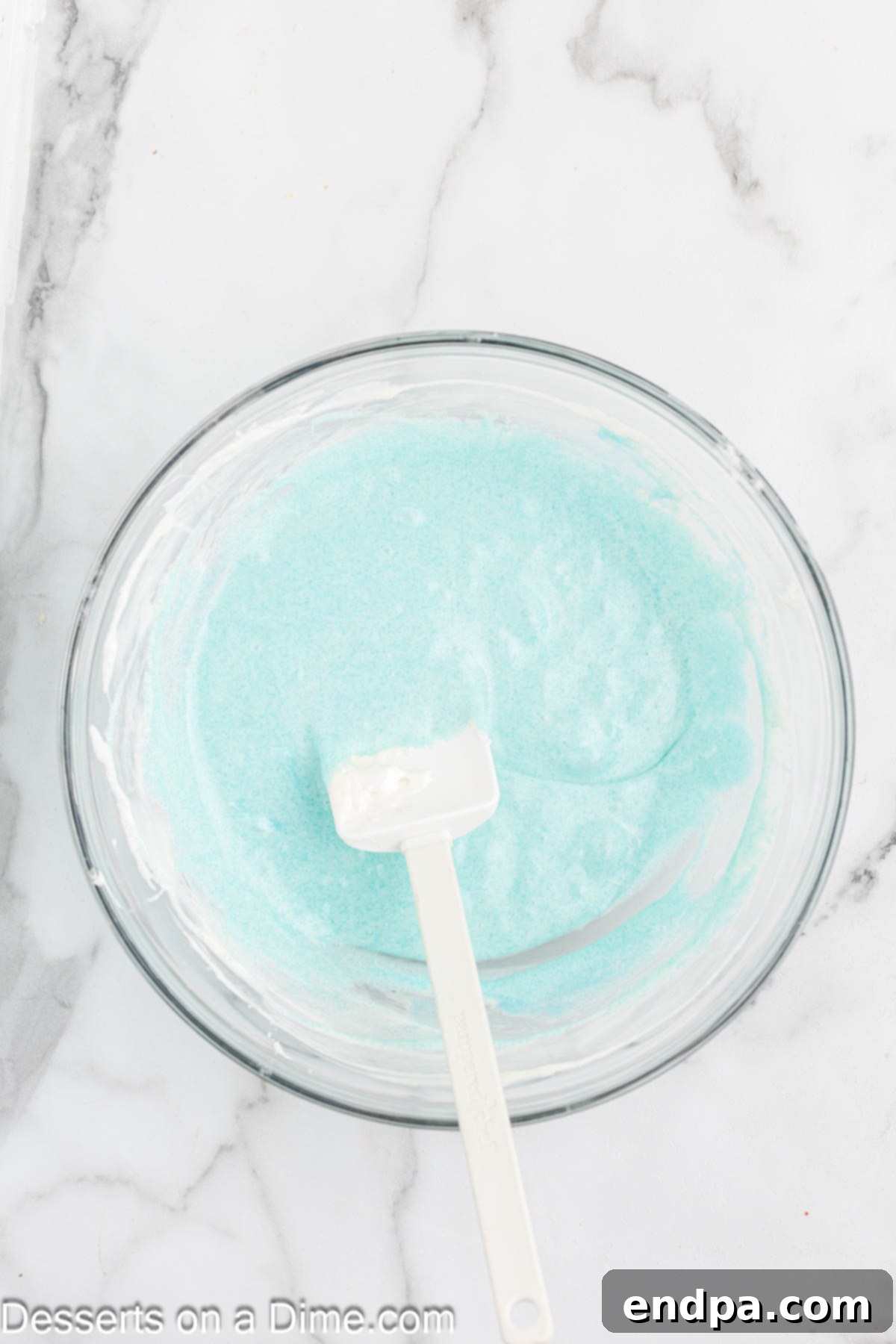 Jello added to marshmallows melted in mixing bowl.