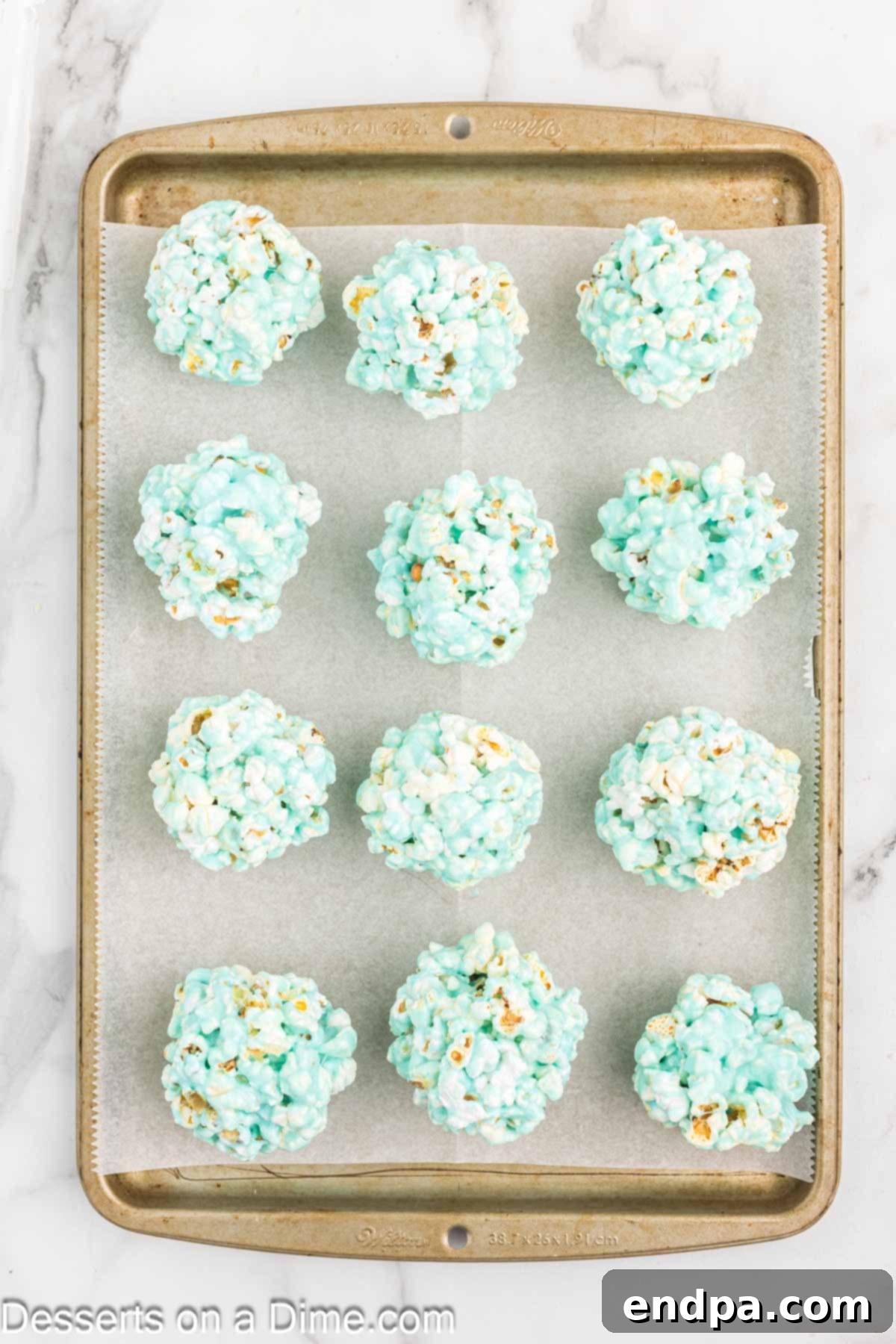 Popcorn balls on baking sheet.