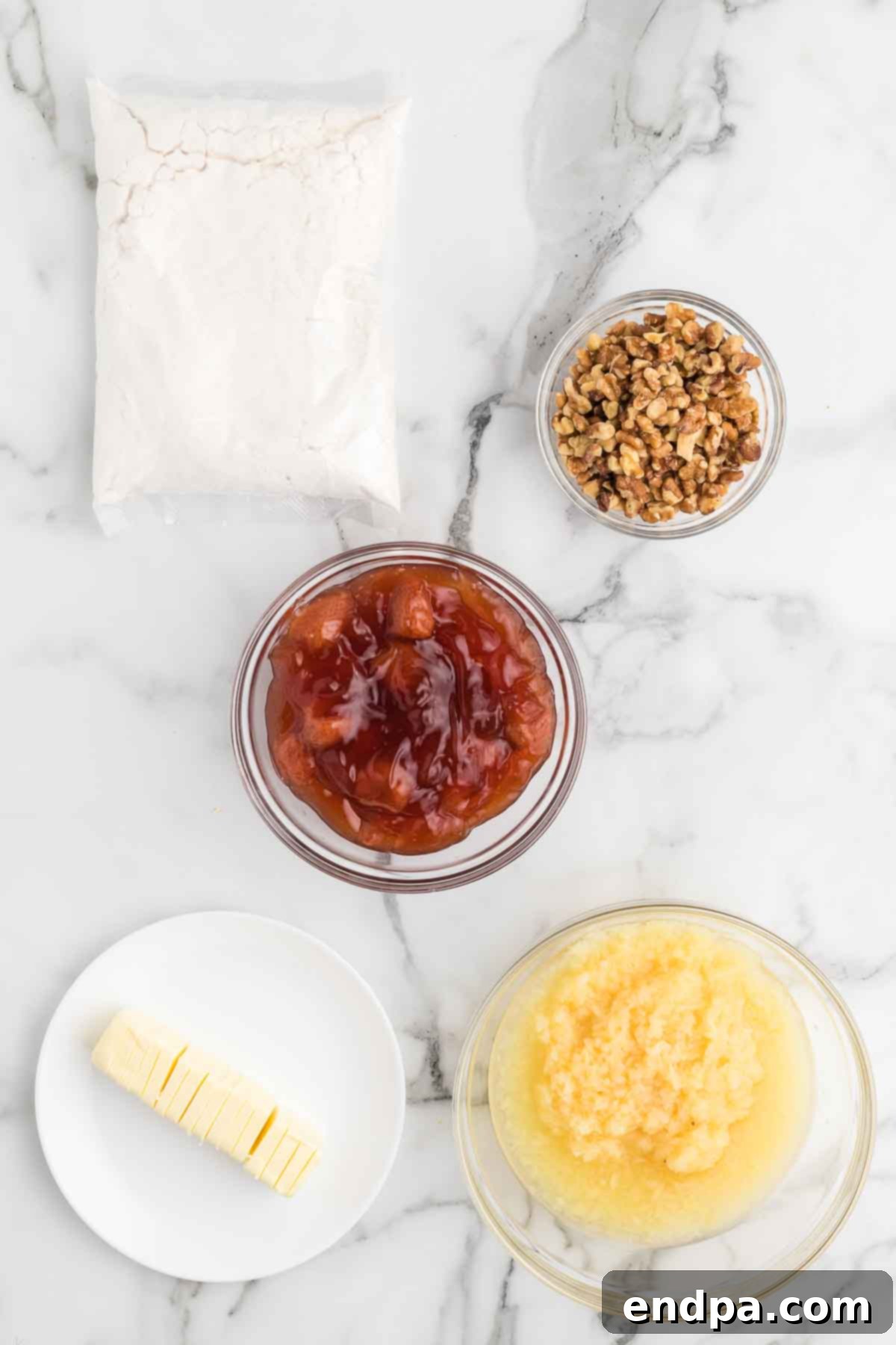 Oven-Baked Banana Split Treat 3 All the essential ingredients for Banana Split Dump Cake laid out: strawberry pie filling, crushed pineapple, white cake mix, butter, walnuts, bananas, chocolate syrup, ice cream, whipped topping, cherries, and sprinkles.