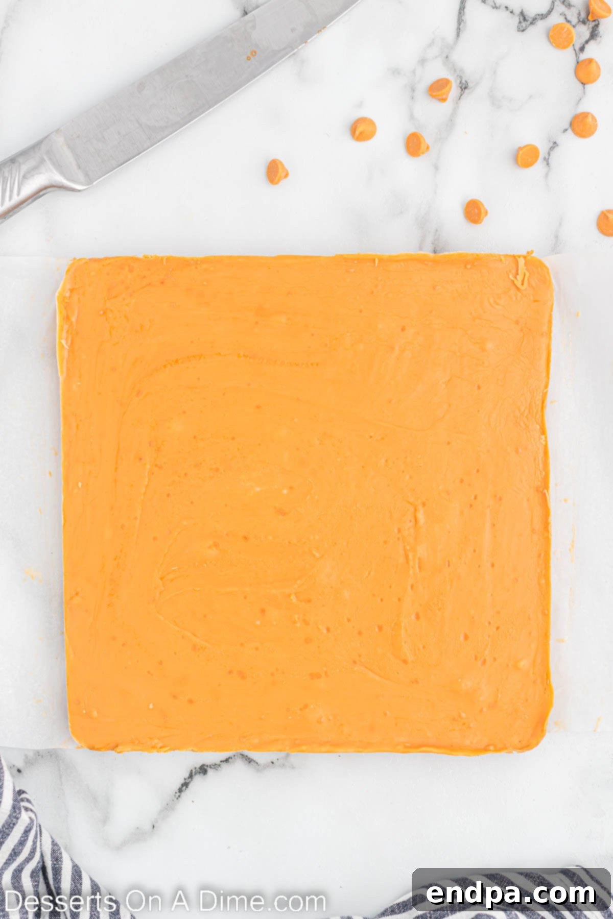 Golden Butterscotch Fudge 6 Fudge mixture spread evenly into the prepared baking dish, ready for chilling.