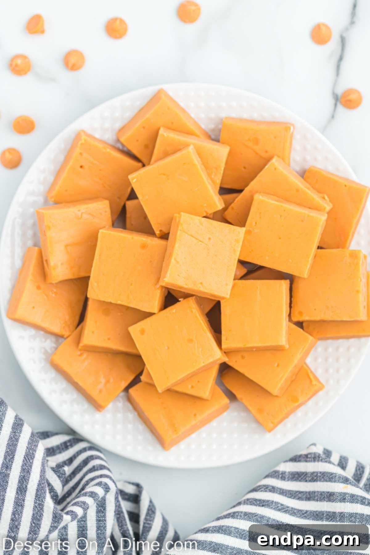 Golden Butterscotch Fudge 8 Butterscotch fudge squares beautifully arranged on a plate.