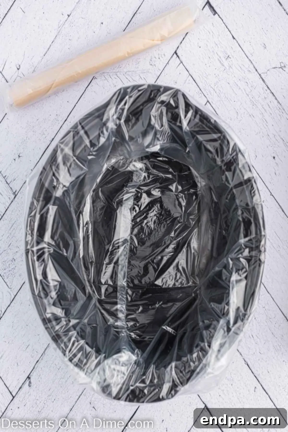 Crock pot liner in crock pot. A clear view of a slow cooker with a liner inserted, ready for the pie crust.