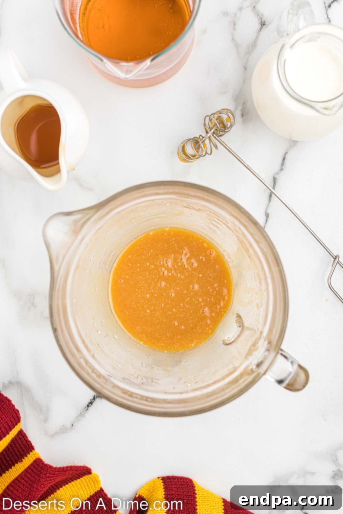 Hogwarts Signature Butterbrew 4 Butterscotch syrup and melted butter combined in bowl.