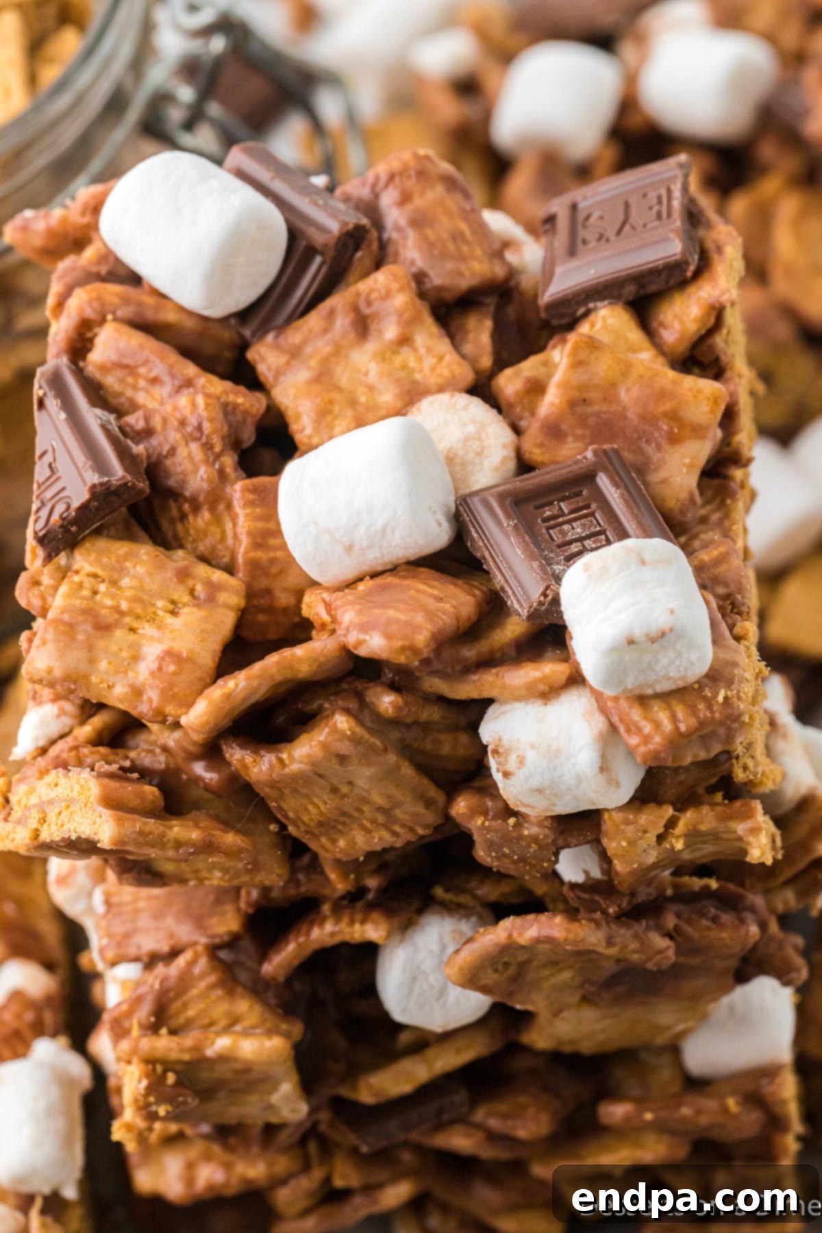 Stacked Golden Graham S'mores Bars, showcasing the layers of cereal, chocolate, and marshmallows.