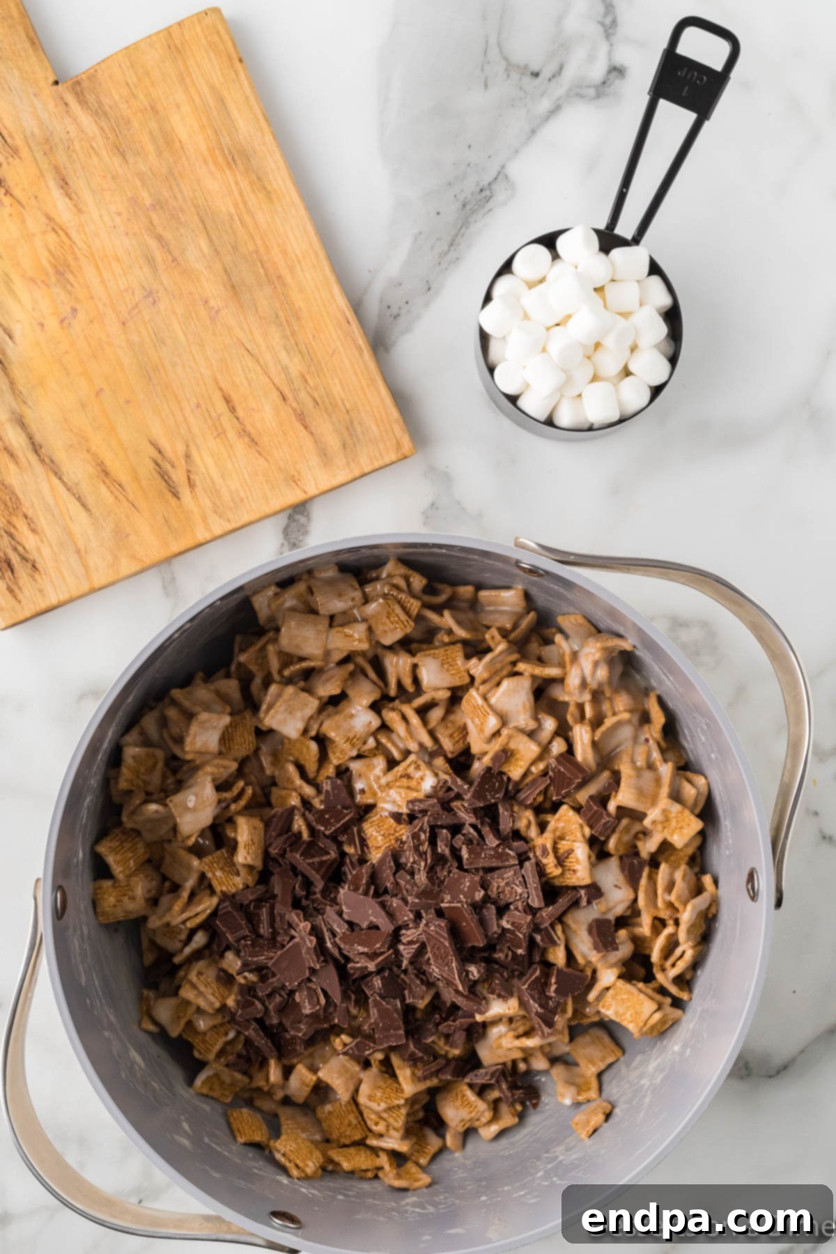 Coarsely chopped chocolate pieces mixed into the Golden Graham and marshmallow mixture.