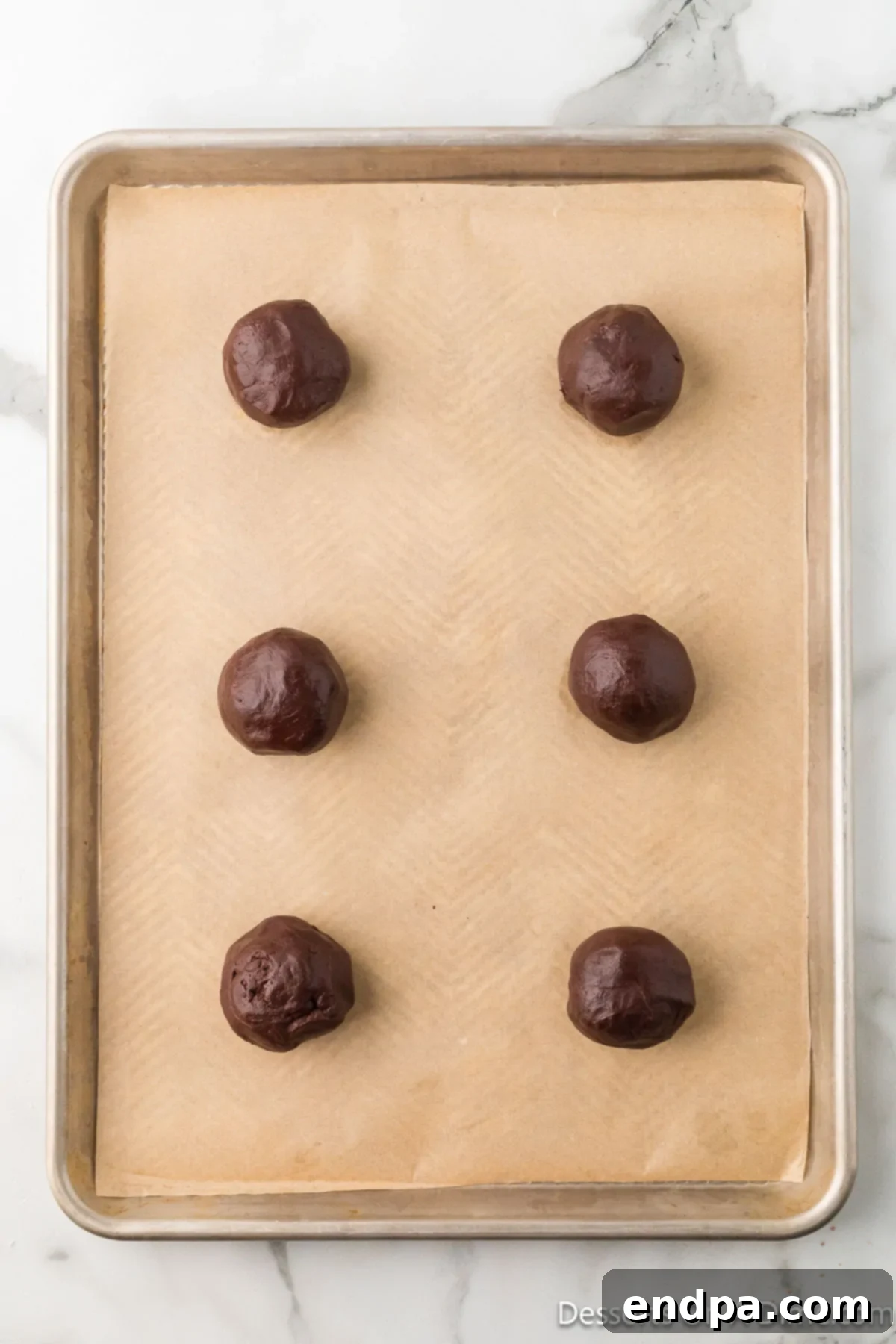 Crumbl Style Buckeye Brownie Cookies 14 Dough shaped into balls.