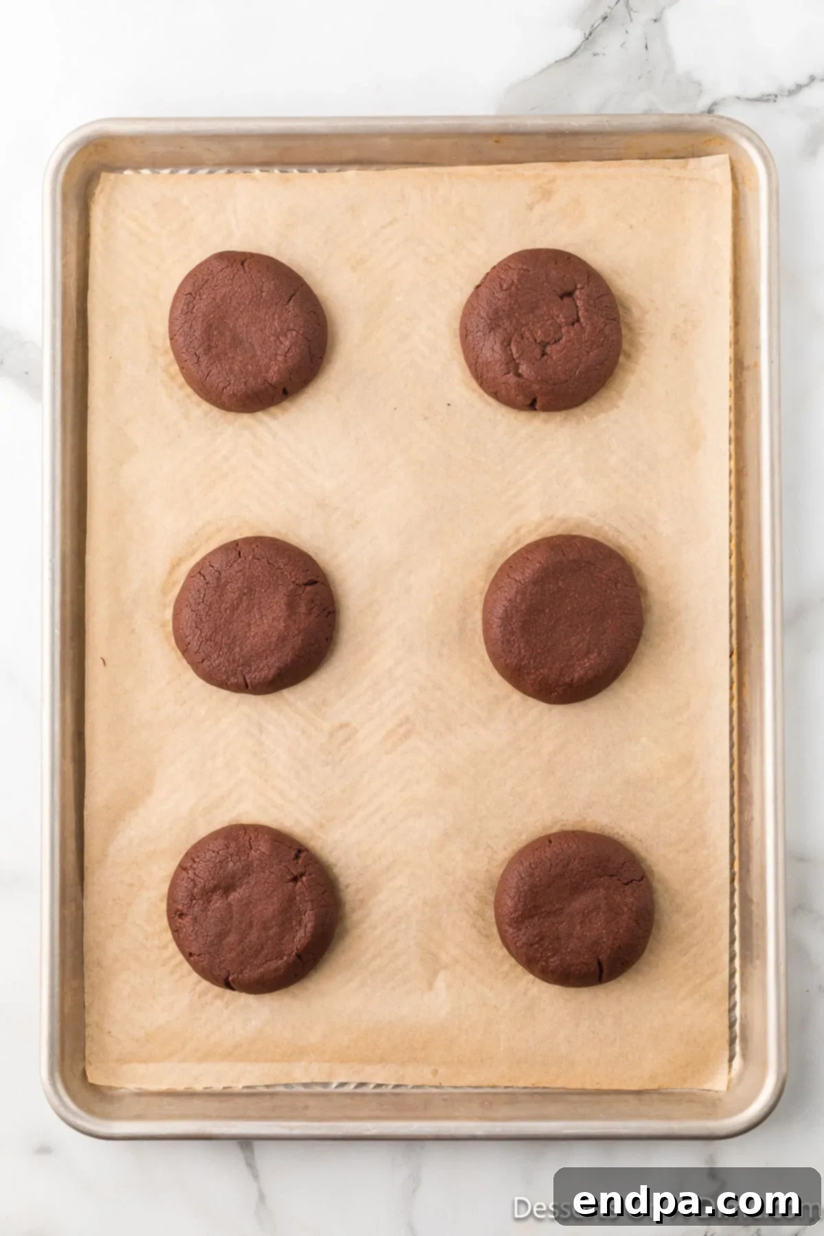 Crumbl Style Buckeye Brownie Cookies 19 Cookies baked and cooling on baking sheet.