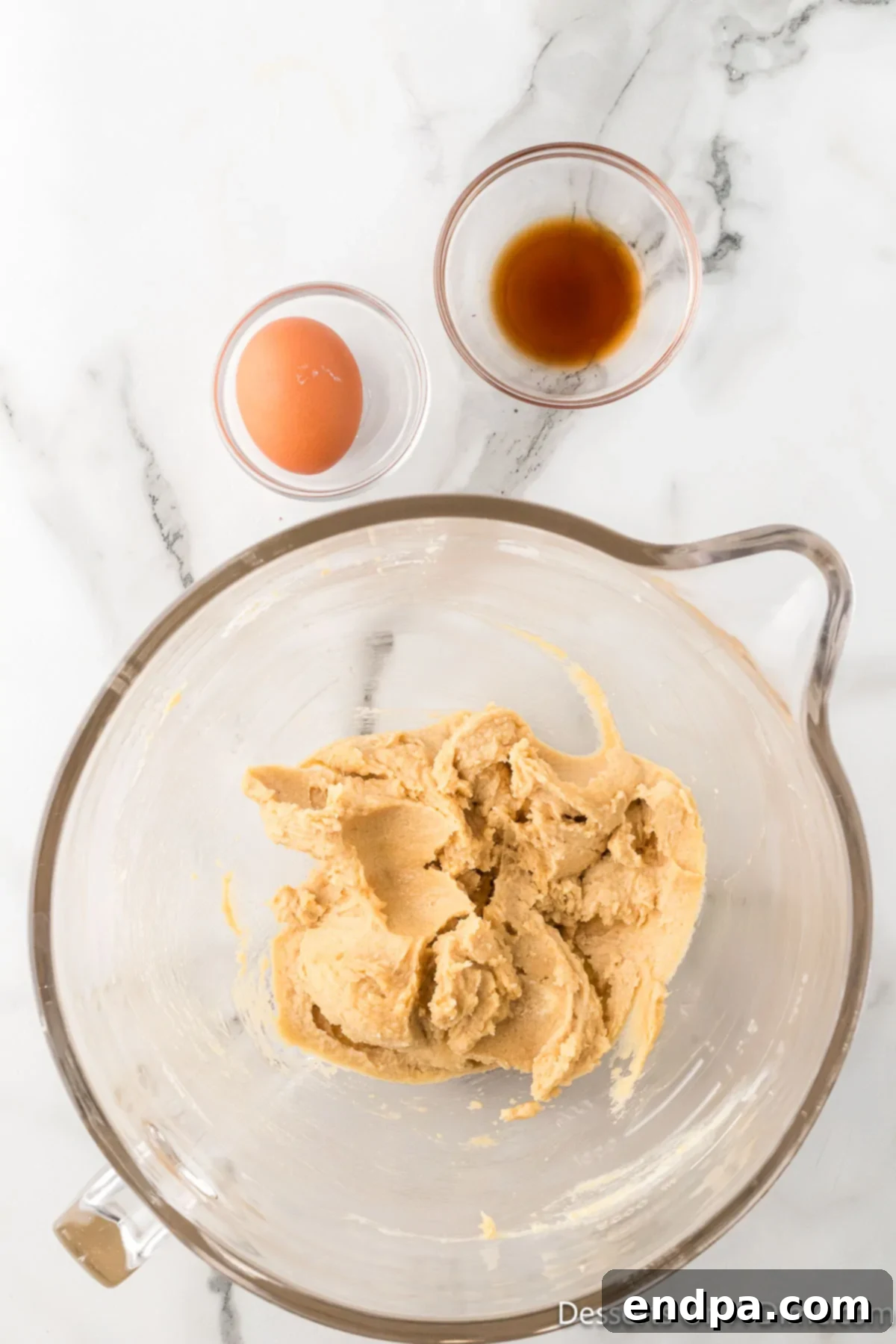 Crumbl Style Buckeye Brownie Cookies 7 Butter and both sugars combined in a bowl.