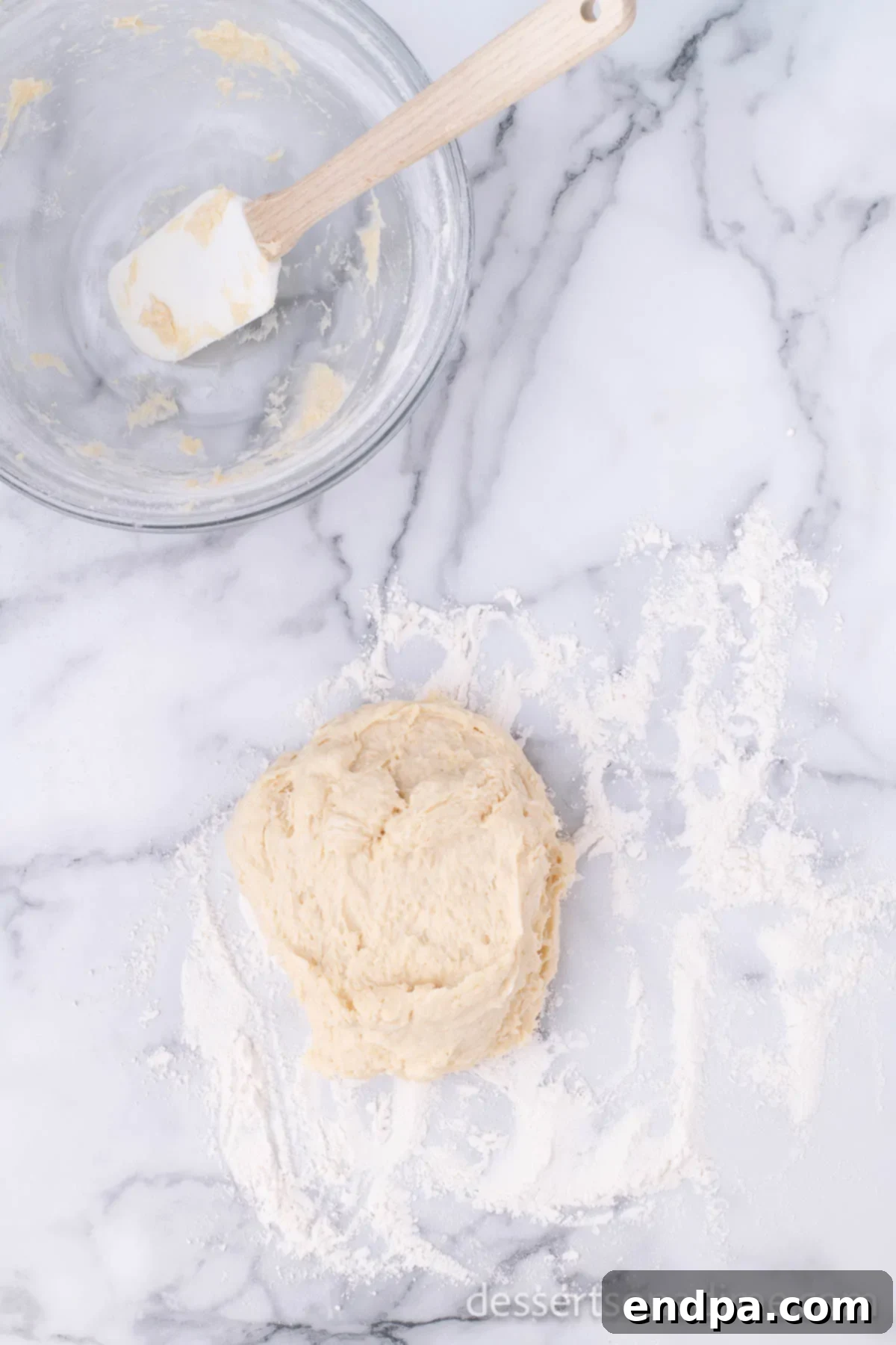 Krispy Kreme Donut Bites 11 Smooth, kneaded donut dough resting on a floured surface, ready for its first rise.