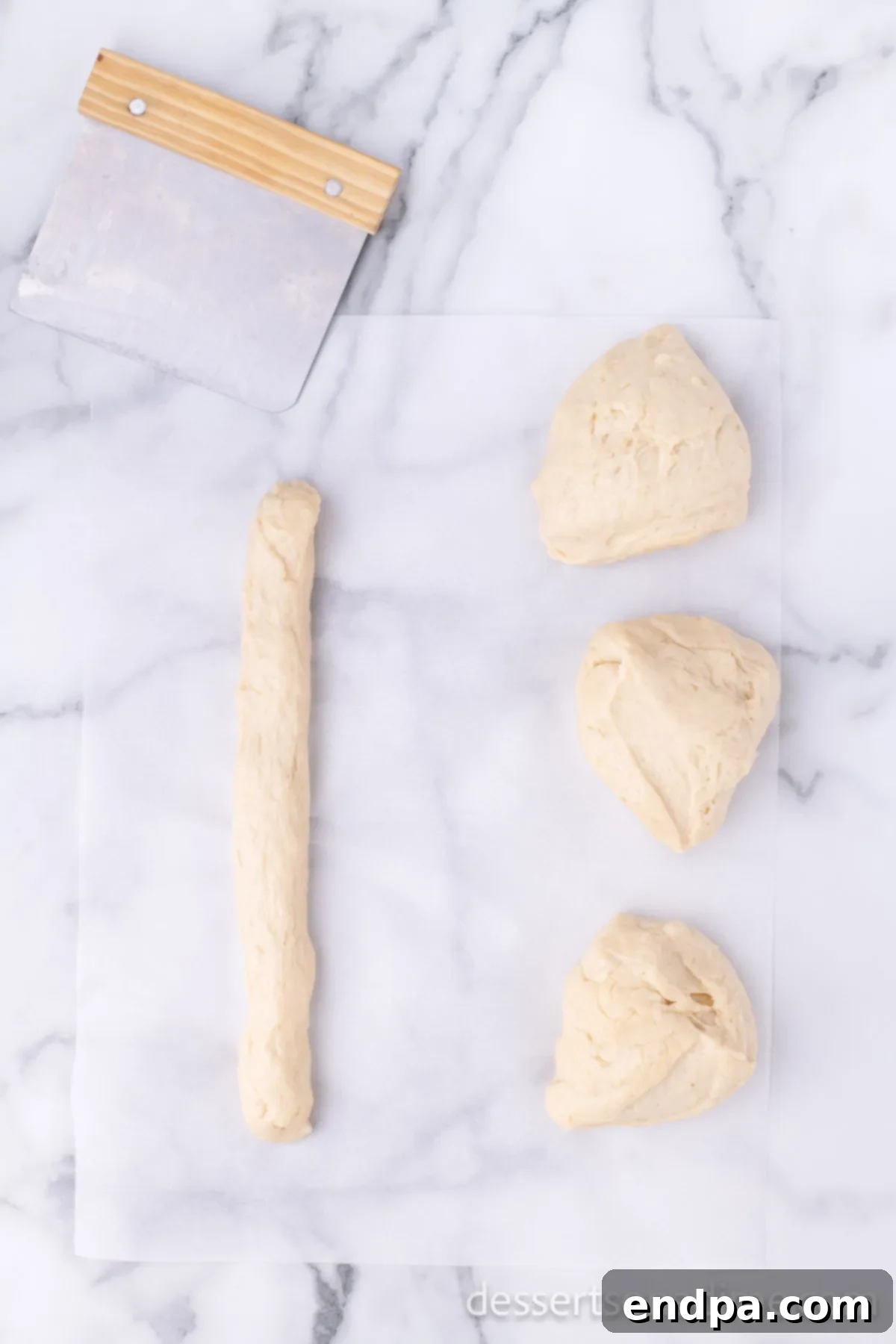 Krispy Kreme Donut Bites 14 Dough separated into four even sections, an intermediary step before rolling into ropes for donut holes.