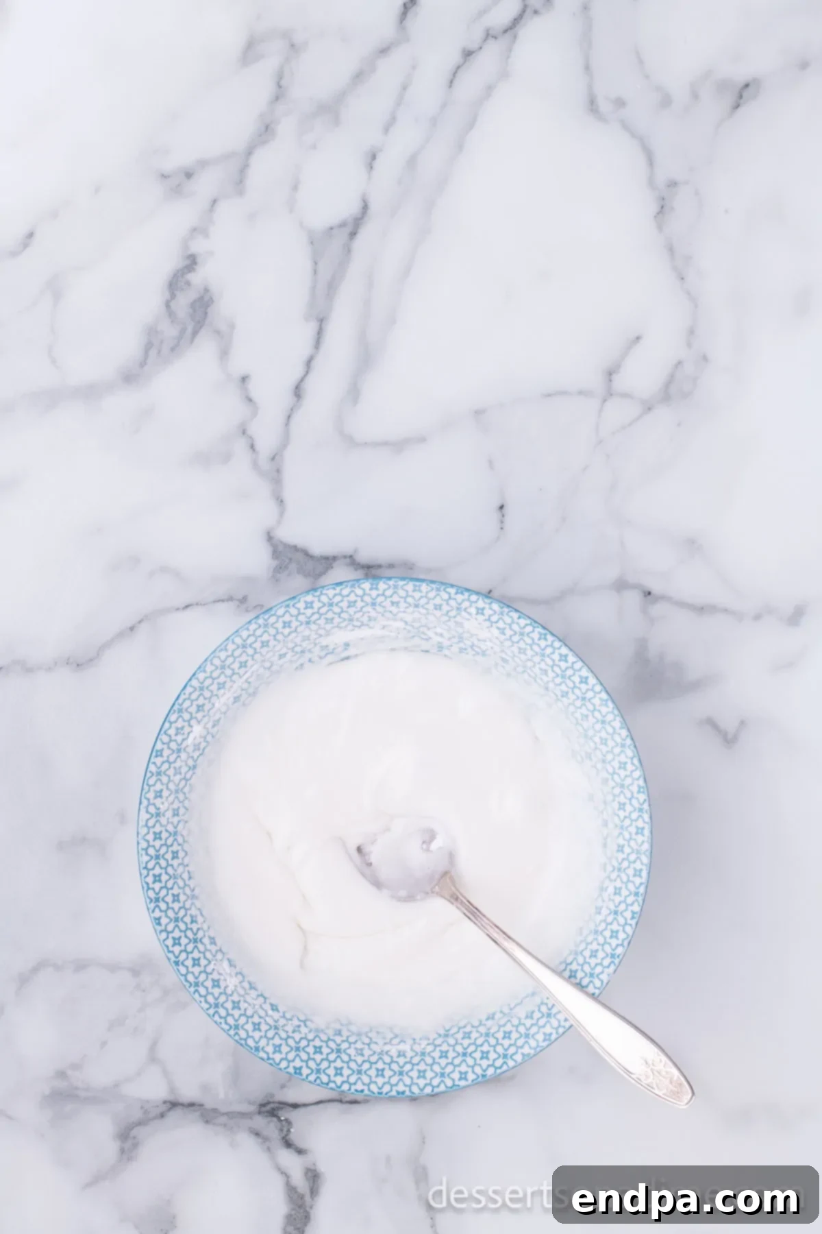 Krispy Kreme Donut Bites 17 A bowl filled with the smooth, glossy glaze mixture, ready for coating the freshly fried donut holes.