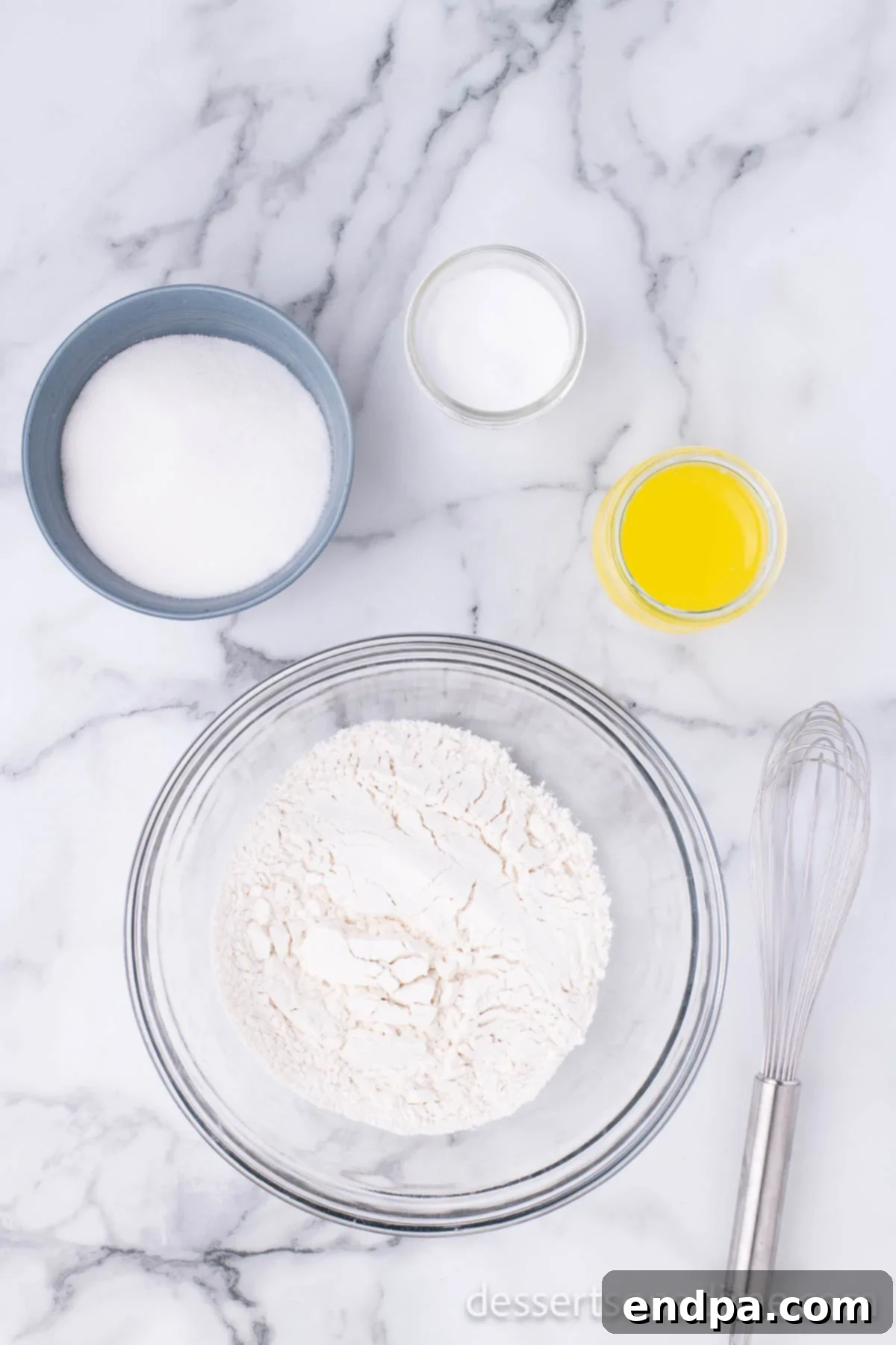 Krispy Kreme Donut Bites 6 All-purpose flour measured out in a mixing bowl, ready to be combined with other donut dough ingredients.