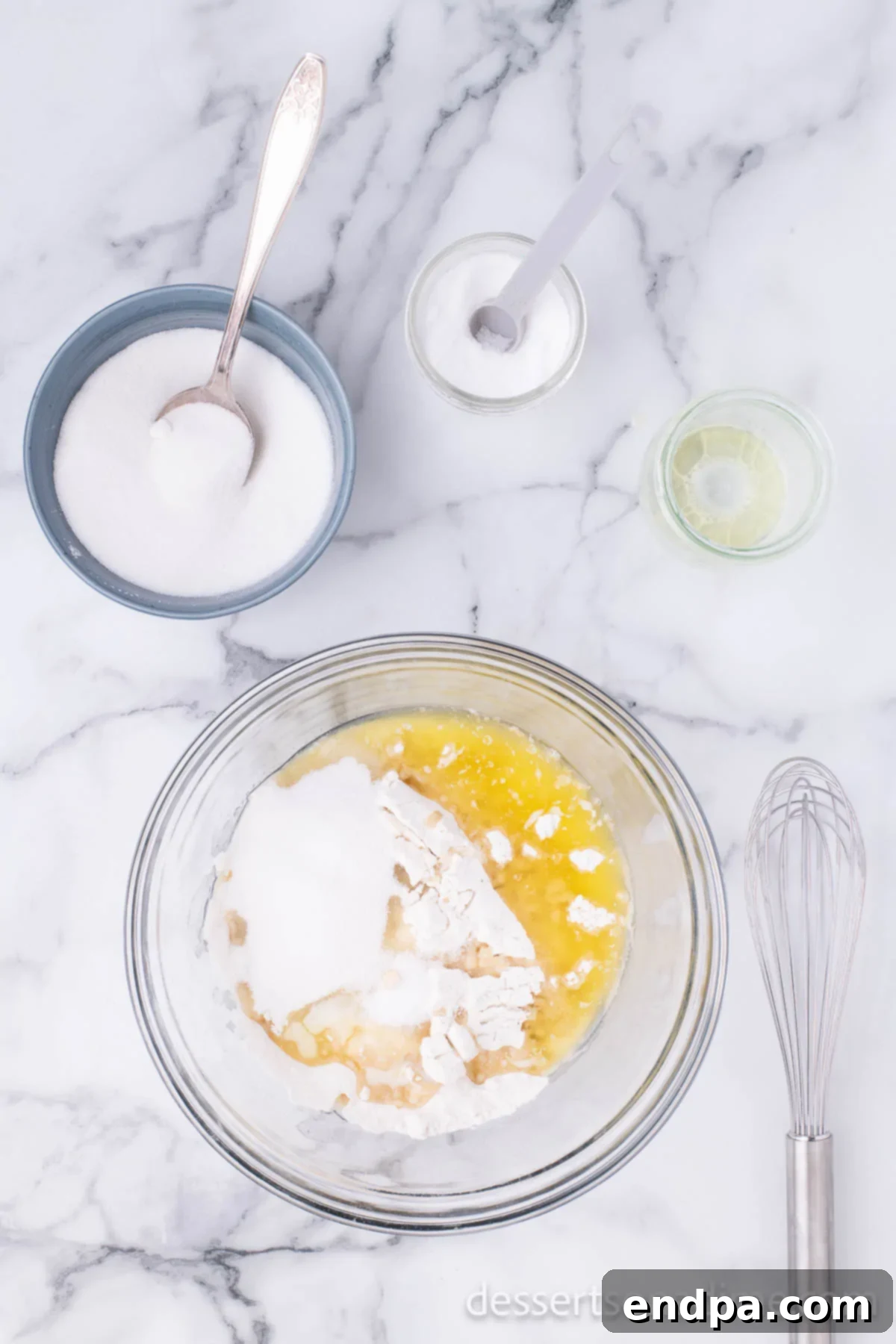 Krispy Kreme Donut Bites 7 Melted butter being added to the flour in a mixing bowl, prior to combining all dough ingredients.