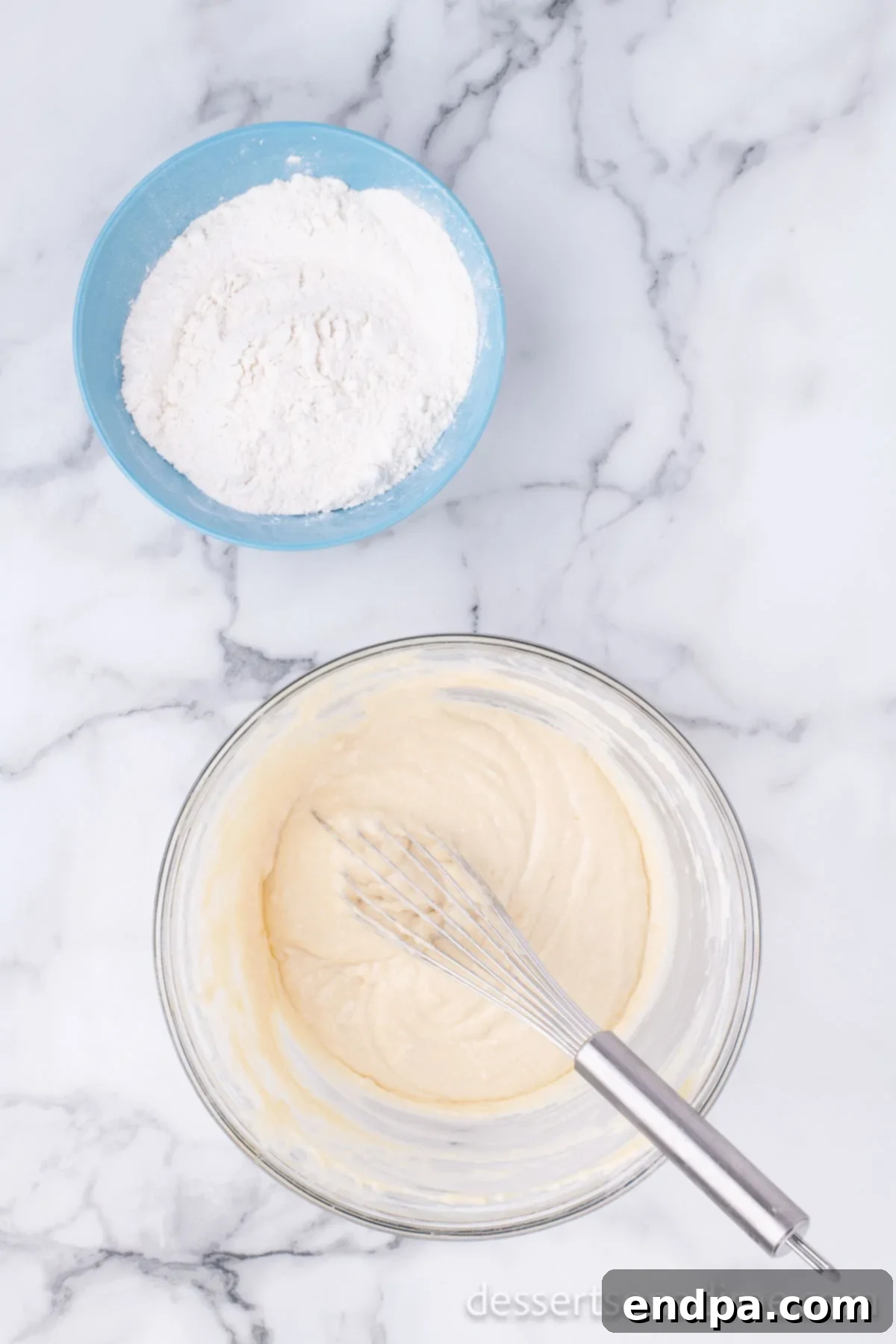 Krispy Kreme Donut Bites 10 Additional flour being mixed into the donut dough, adjusting its texture for optimal kneading.