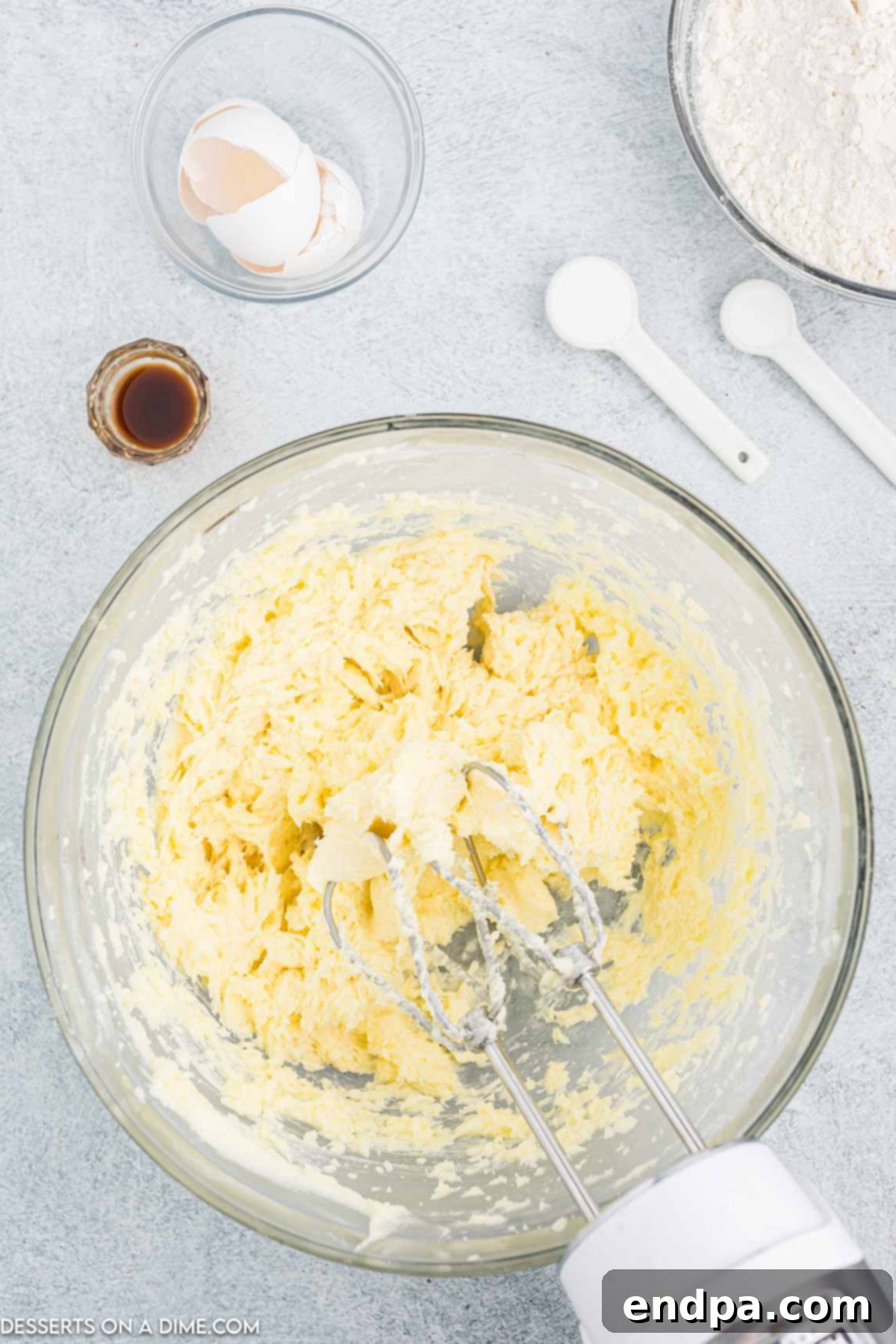 Vibrant Jello Bites 4 Butter and sugar creamed together in a mixing bowl.