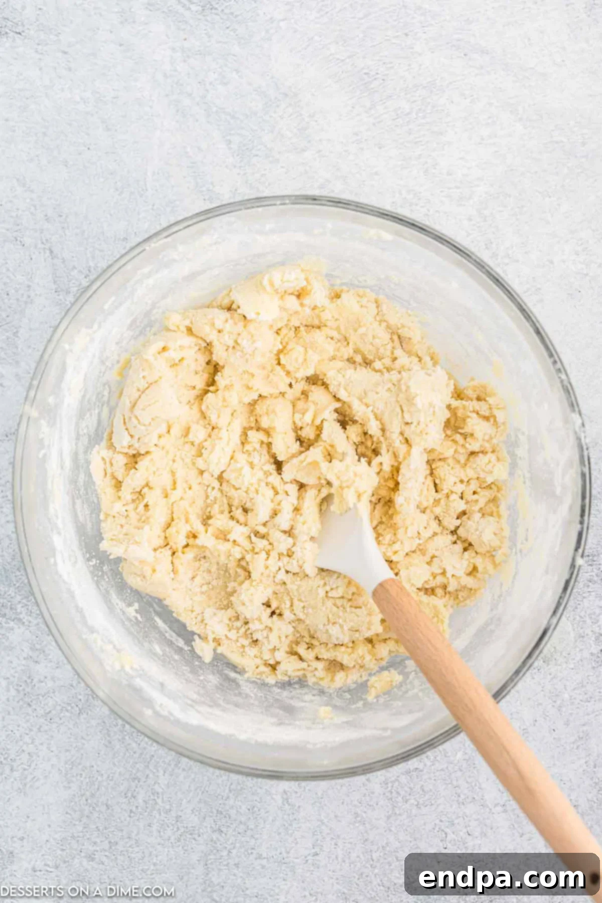 Vibrant Jello Bites 5 Flour mixture being added to the wet butter and sugar mixture.