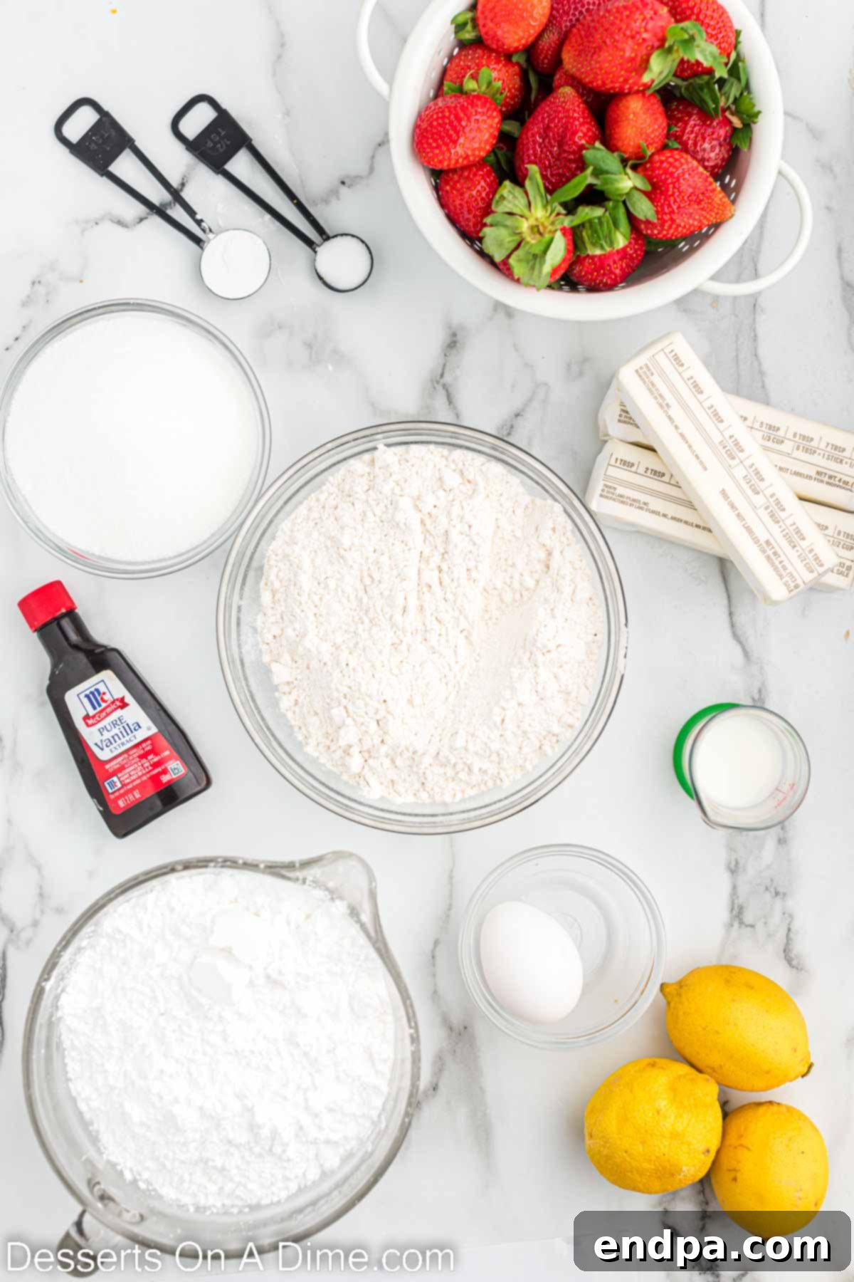 Ingredients for Strawberry Lemonade Sugar Cookie Bars laid out: butter, vanilla extract, fresh lemon juice, all-purpose flour, and lemon zest.