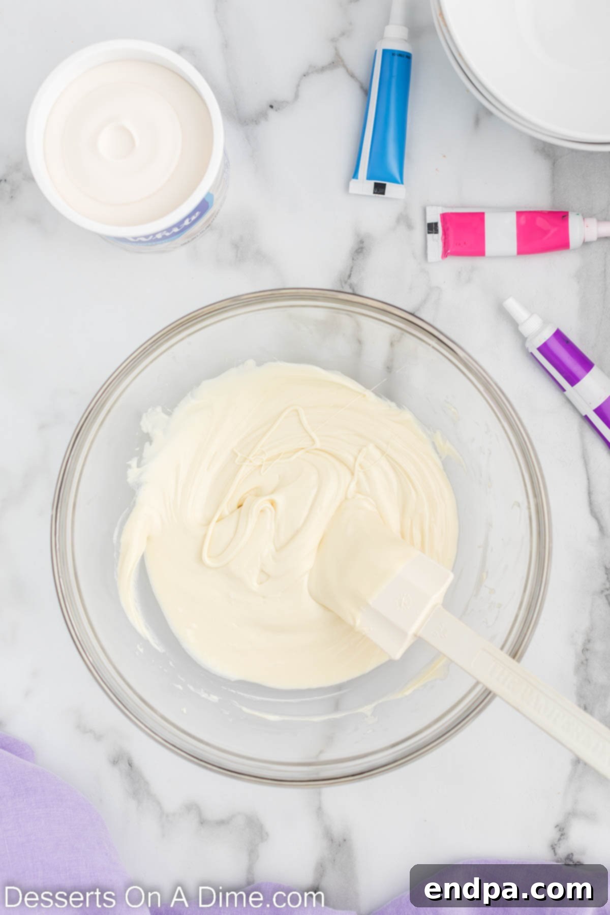 Enchanted Unicorn Swirl Fudge 4 A bowl filled with perfectly melted white chocolate, smooth and glossy.