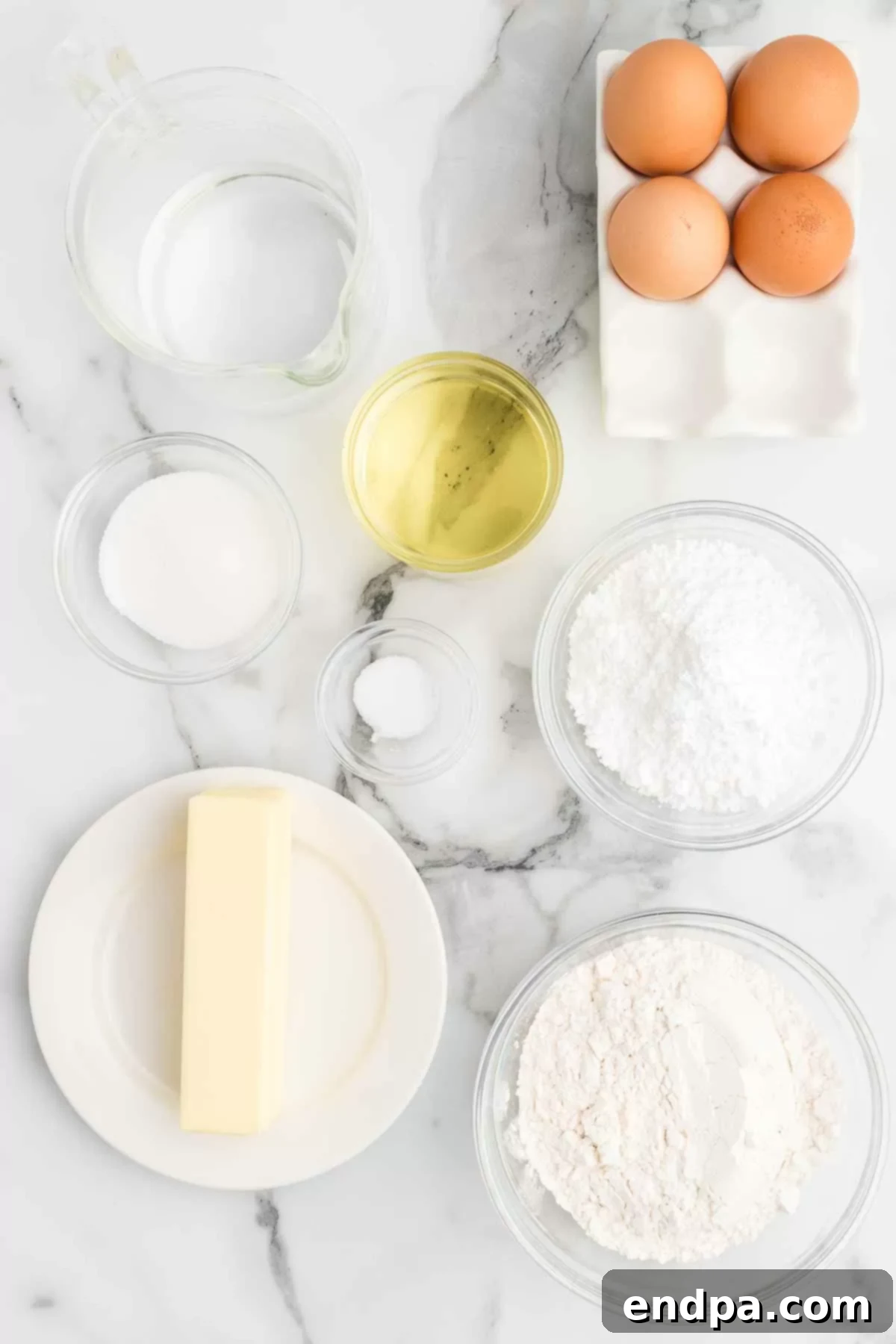 Classic Italian Zeppole Recipe 3 Ingredients for Italian donuts - butter, flour, eggs, oil, powdered sugar.
