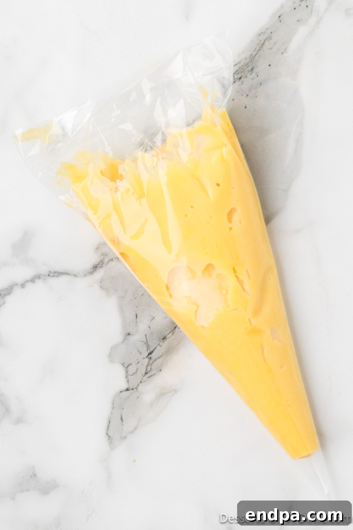 Classic Italian Zeppole Recipe 7 Dough added to piping bag.