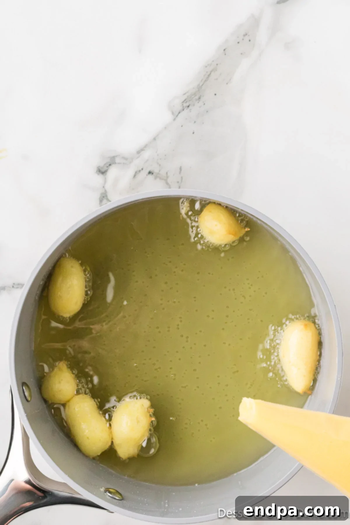 Classic Italian Zeppole Recipe 8 Dough piped in hot oil.