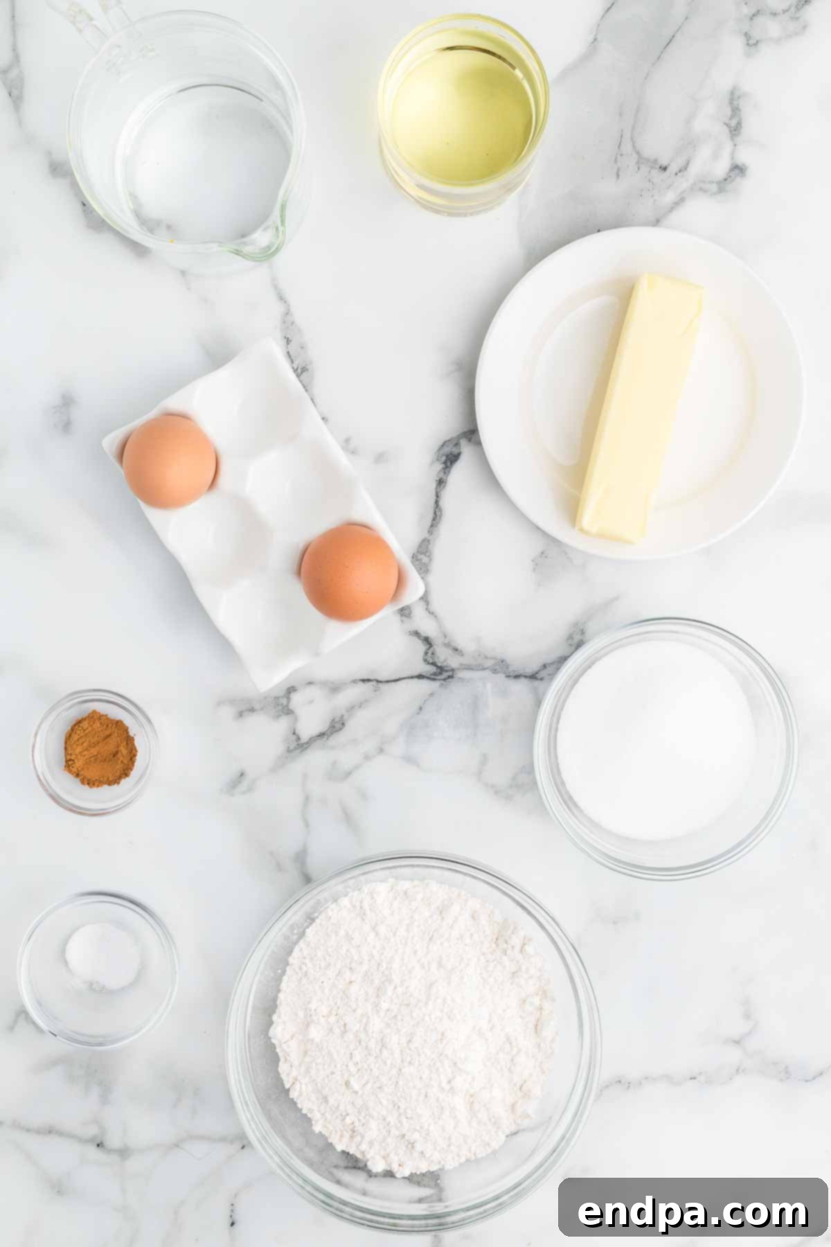 Ingredients for making churro bites laid out on a table.
