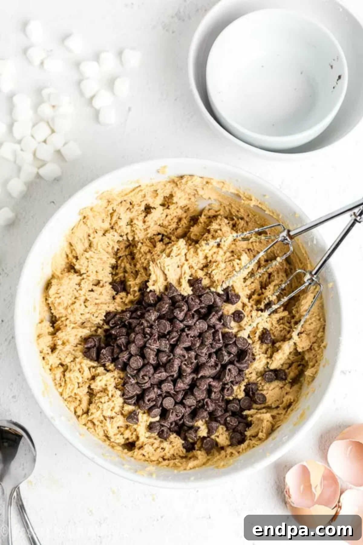 Campfire Smores Cookies 3 A stand mixer bowl showing the wet and dry ingredients fully combined, creating a rich, ready-to-bake s'mores cookie dough.