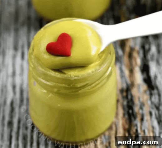 Grinchmas Dessert Delights 11 Grinch Fudge in a Jar, showing layers of green and white fudge.