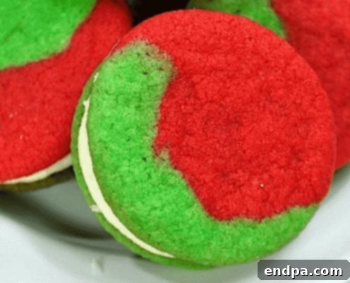 Grinchmas Dessert Delights 16 Grinch Cookie Sandwich with green cookies and white frosting.